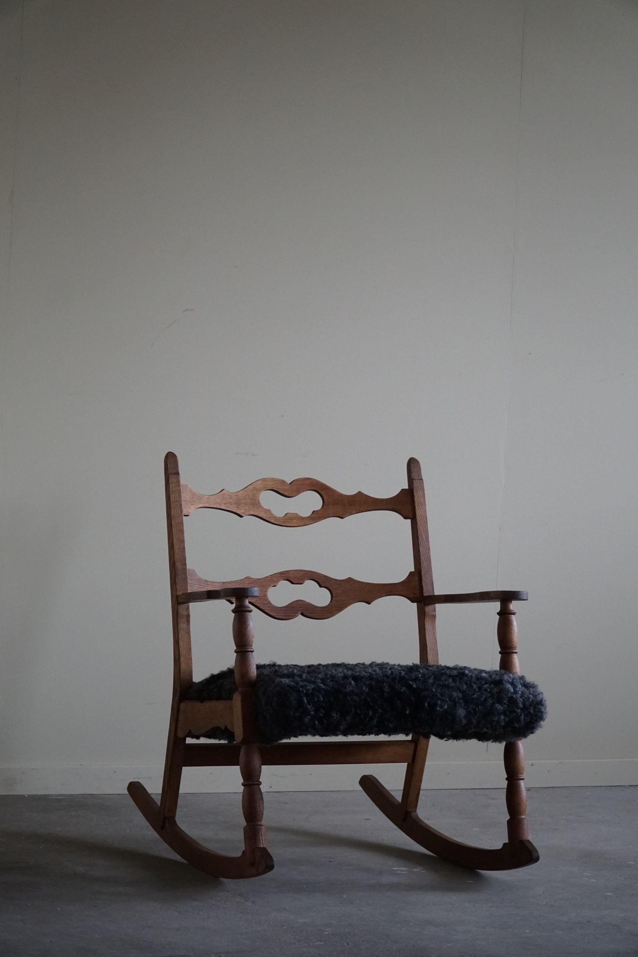 Henning Kjærnulf, Rocking Chair in Oak, Seat in Gotland Sheepskin, 1960s For Sale 2