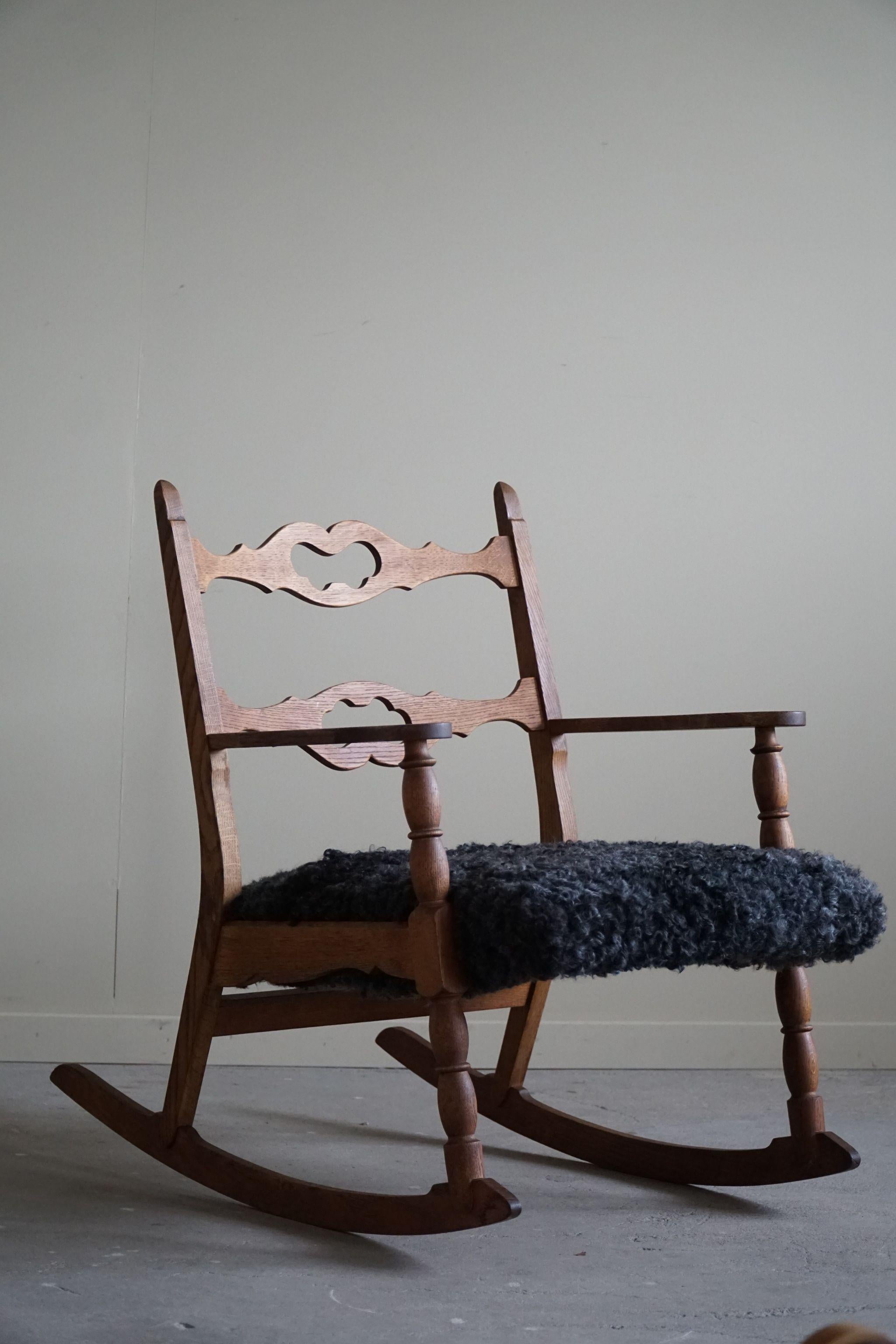 Henning Kjærnulf, Rocking Chair in Oak, Seat in Gotland Sheepskin, 1960s For Sale 3