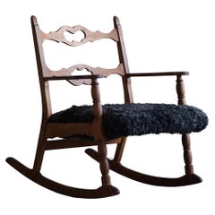 Vintage Henning Kjærnulf, Rocking Chair in Oak, Seat in Gotland Sheepskin, 1960s