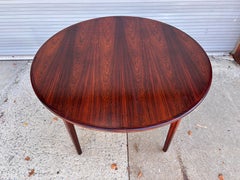 Mesa de comedor de palisandro de Henning Kjaernulf con 2 extensiones