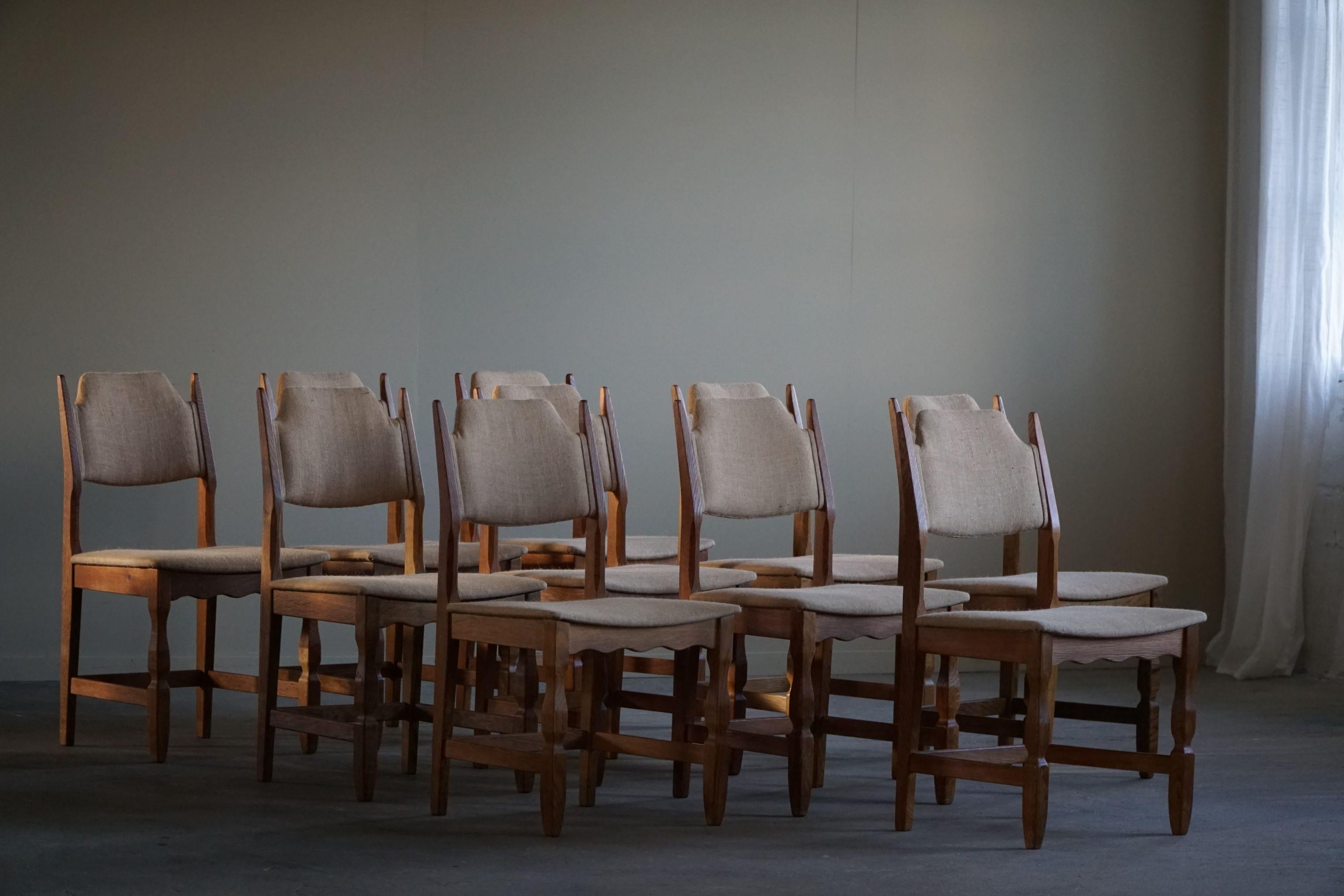 An incredible set of 10 dining chairs in oak, seat & back reupholstered in a organic hessian, adding a touch of rustic charm while ensuring comfort and durability. This set is in the series of the popular 