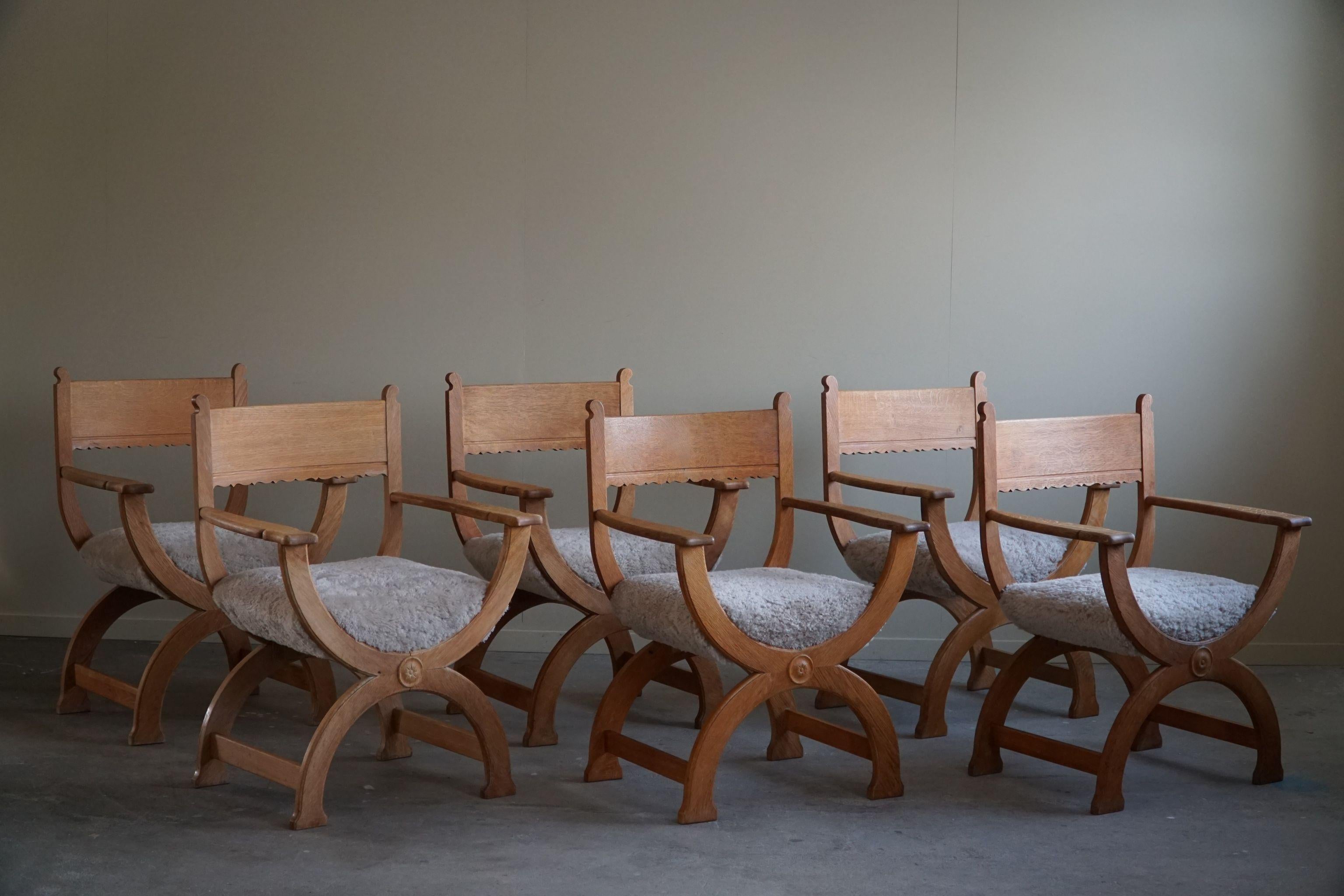 A fine and rare set of 6 armchairs in oak, reupholstered seats in a great quality shearling lambswool. Designed by Henning Kjaernulf for EG Kvalitetsmøbel, Denmark in the 1960s. 

The overall impression of these mid century chairs is really good,