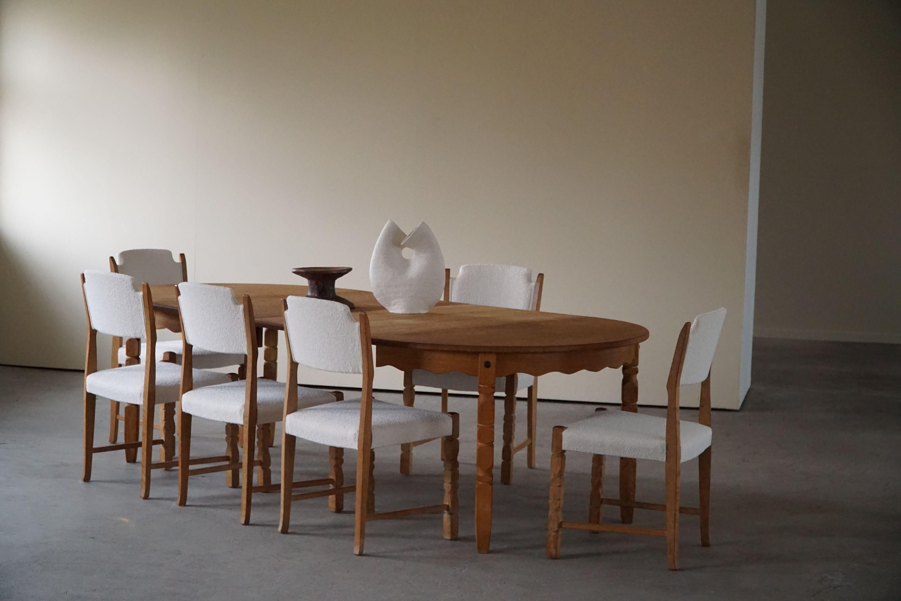 Such an admirable set of 6 dining chairs in oak, seats & back reupholstered in ivory bouclé. This set is in the series of the popular 