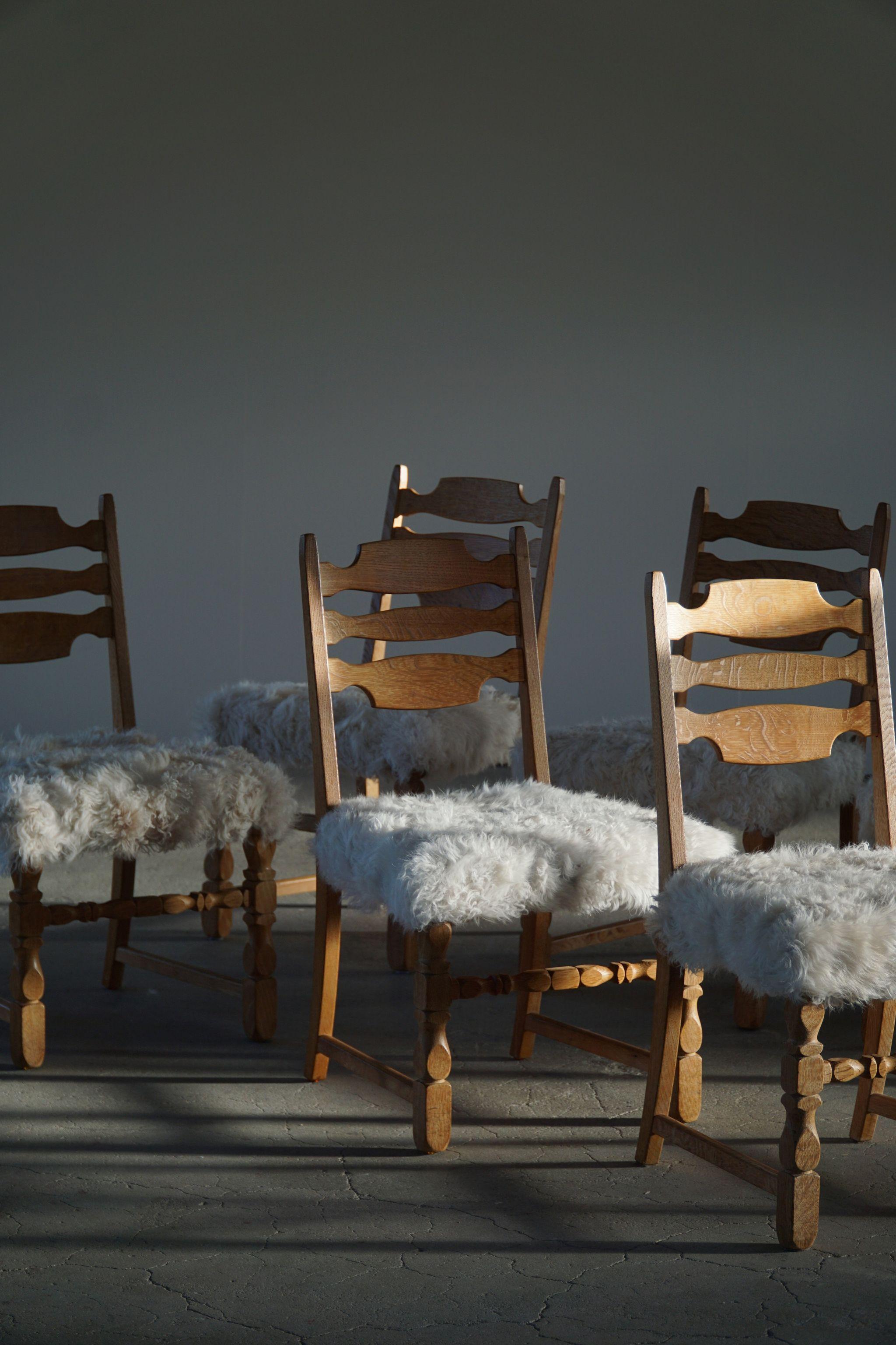 Such a sculptural set of 6 dining chairs in oak, seats reupholstered in lambswool. Strong references to the other popular 