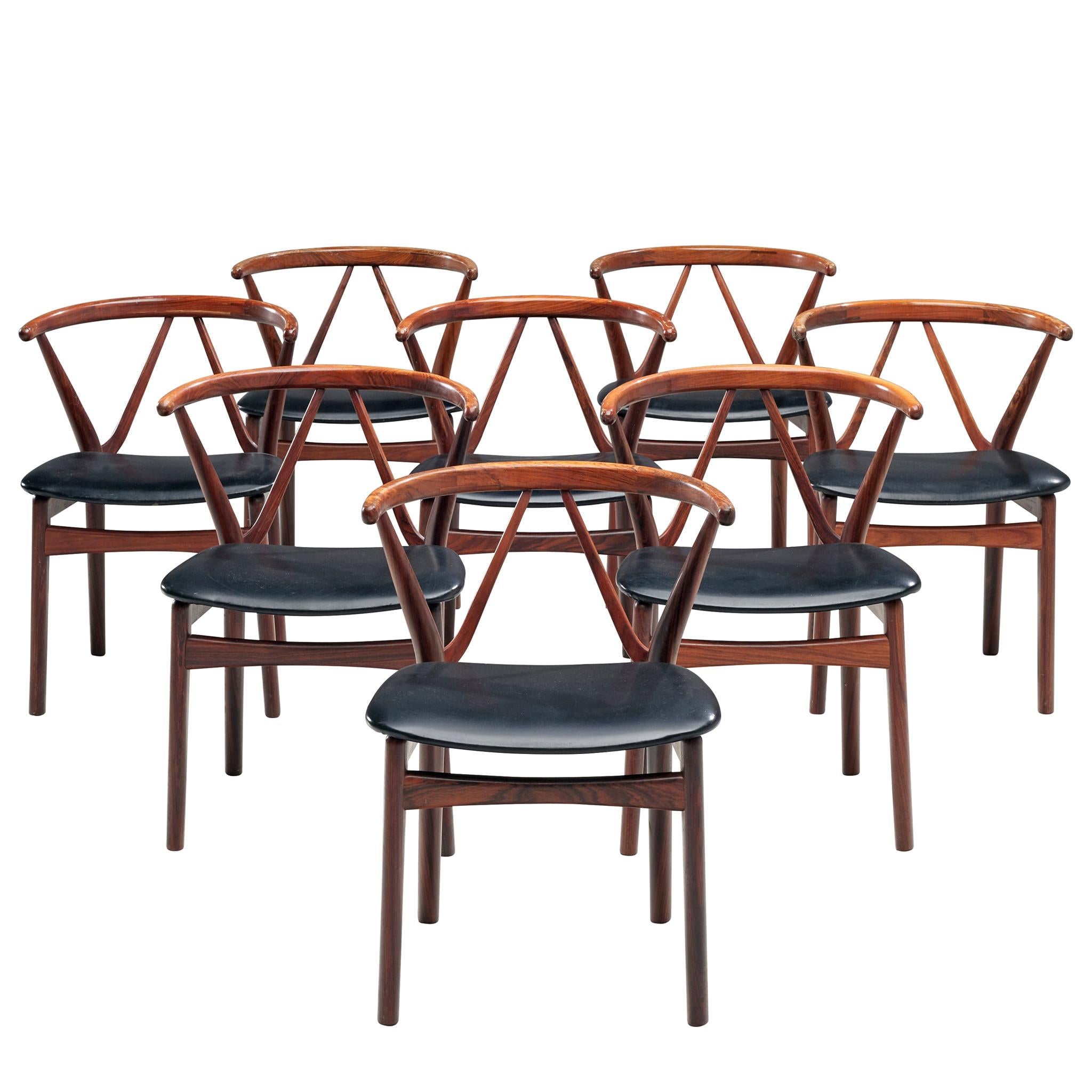 Henning Kjaernulf Set of Eight Dining Chairs in Rosewood