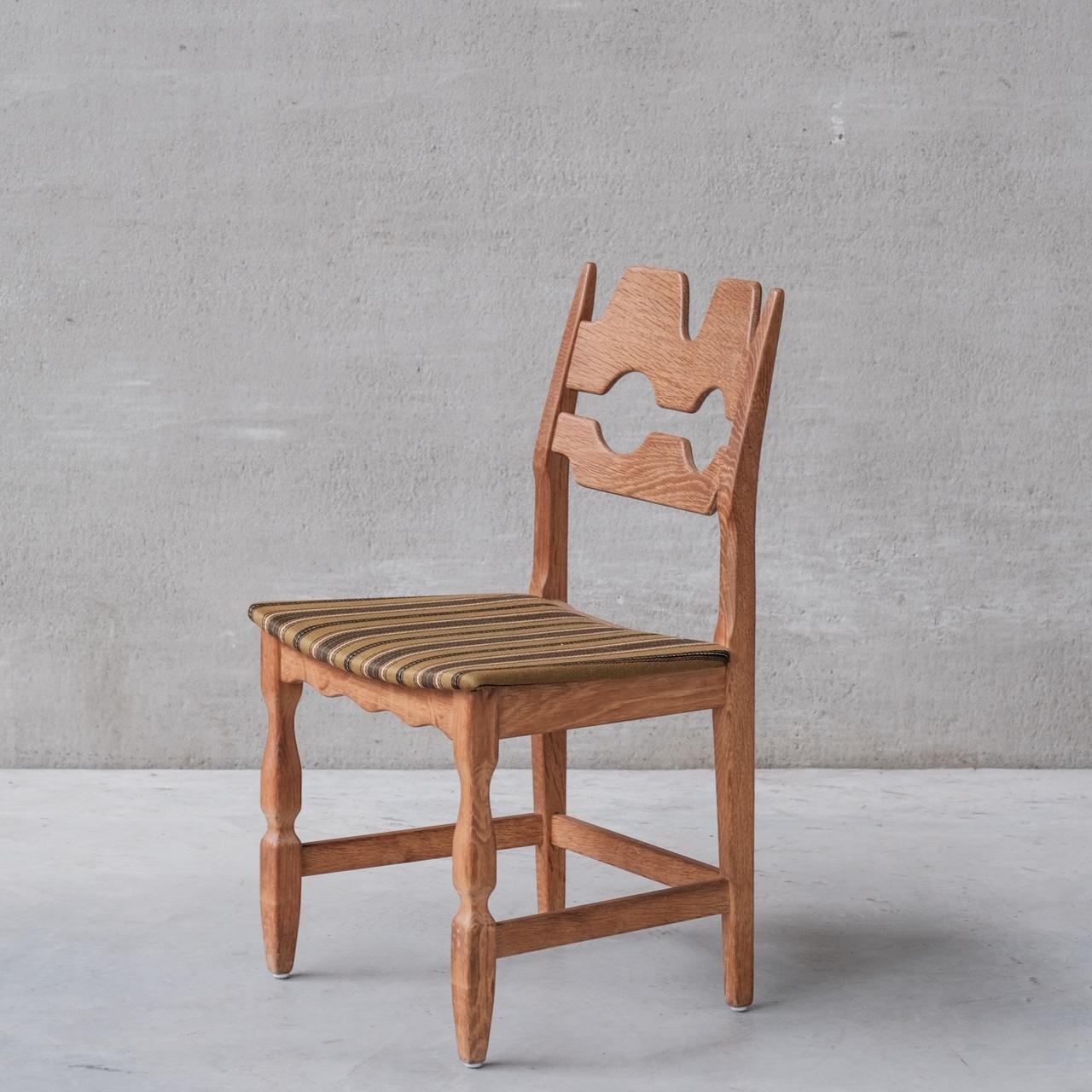 Oak dining chairs by Henning Kjaernulf.

Denmark, c1960s.

'Razor back' or 'Razor blade' model.

Generally good condition for the wood, some wear and scuffs commensurate with age. 

Original upholstery has been retained but want's updating.
