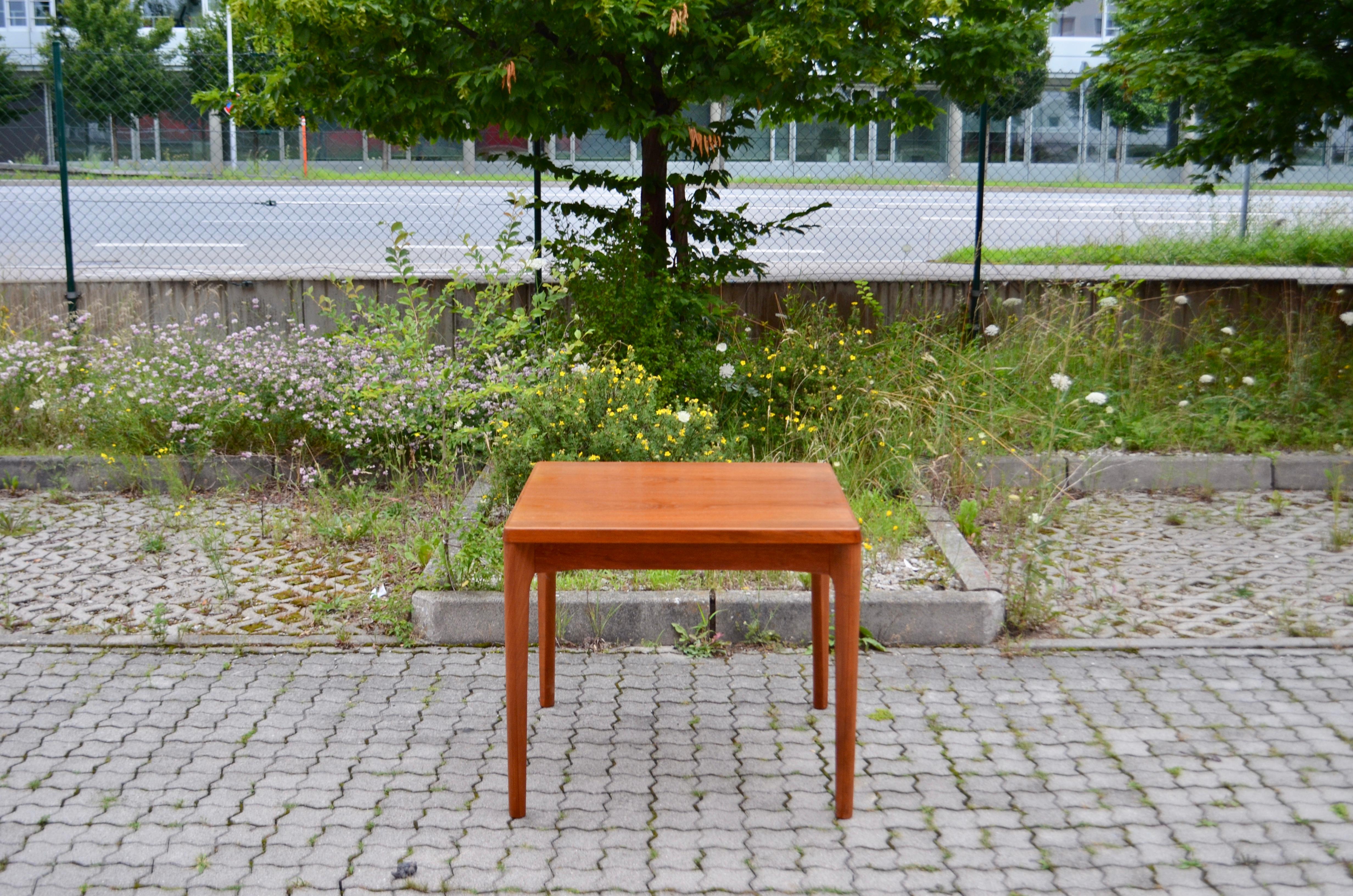 Danish dining table made of Teak from Henning Kjaernulf. Produced by Vejle Stolefabrik
Produced by Vejle Stole Moebelfabrik
The table has a nice square design.
It is extendable from 84cm into 150 cm.
All feet can be dismantled.

 