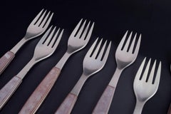 Henning Koppel for Georg Jensen. Eight dinner forks in stainless steel, 1970s