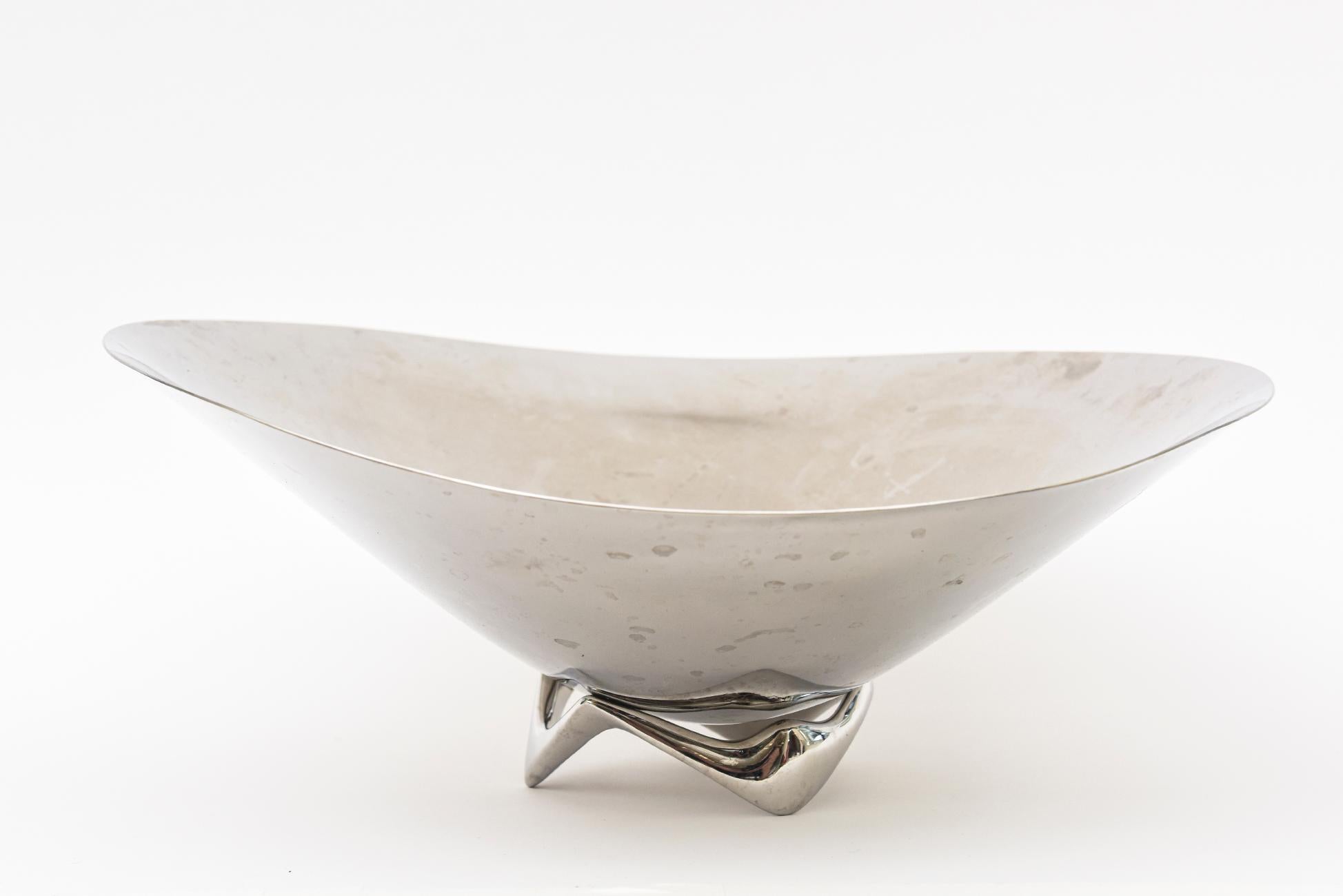 This large undulating hallmarked stainless steel polished organic modern bowl was designed by Henning Koppel for Georg Jensen in 2011. It is biomorphic in form and has a beautiful base of an interesting shape. Great for serving or just as. Good