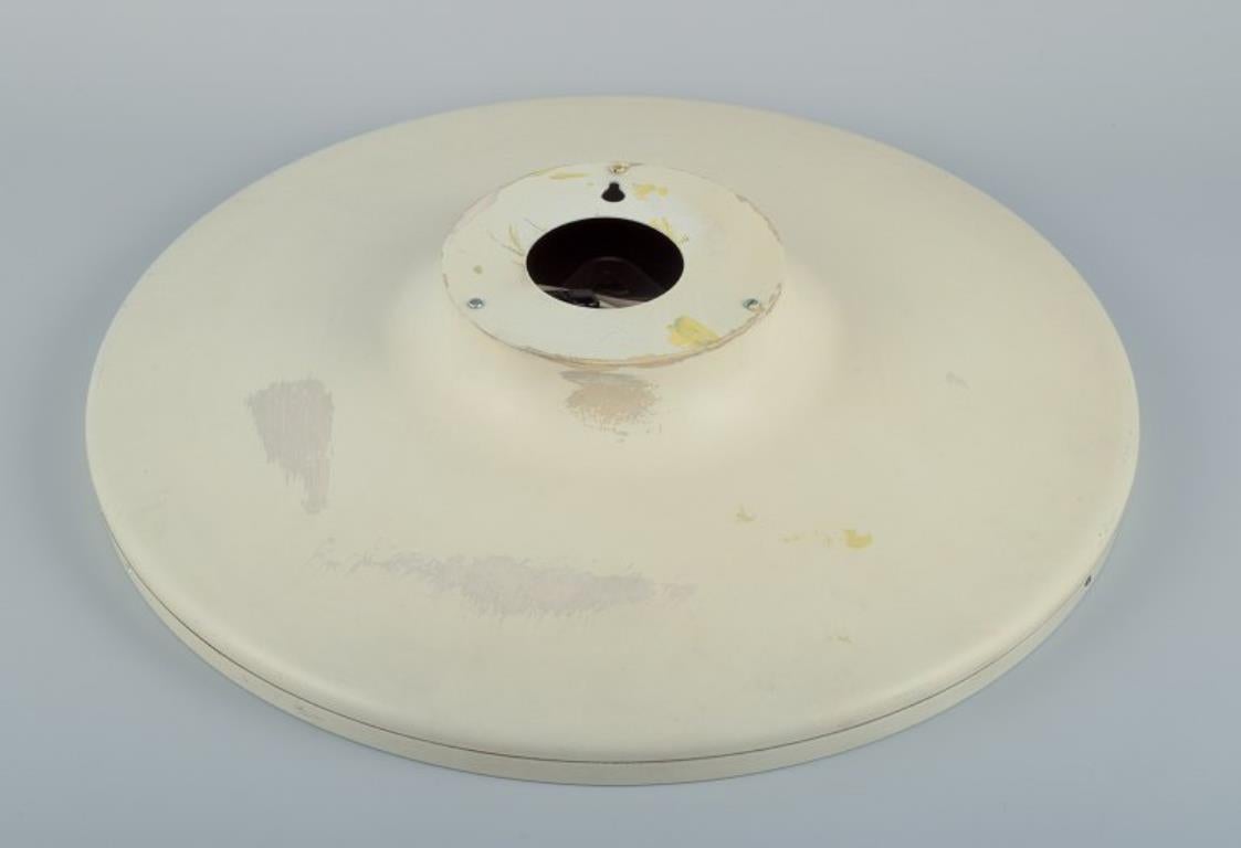 Henning Koppel for Georg Jensen. Wall clock made of white plastic and metal. In Good Condition For Sale In Copenhagen, DK