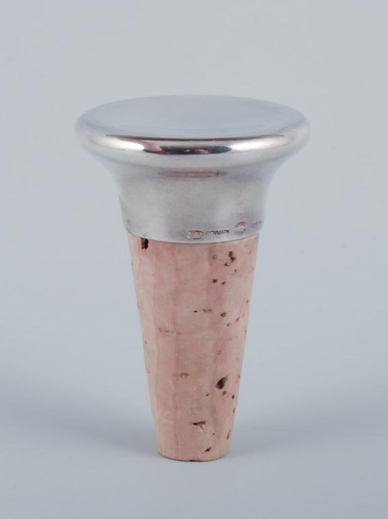 Danish Henning Koppel for Georg Jensen. Wine stopper in sterling silver and cork For Sale