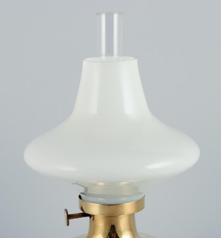 Danish Henning Koppel for Louis Poulsen. Petronella oil lamp in brass and opal glass For Sale