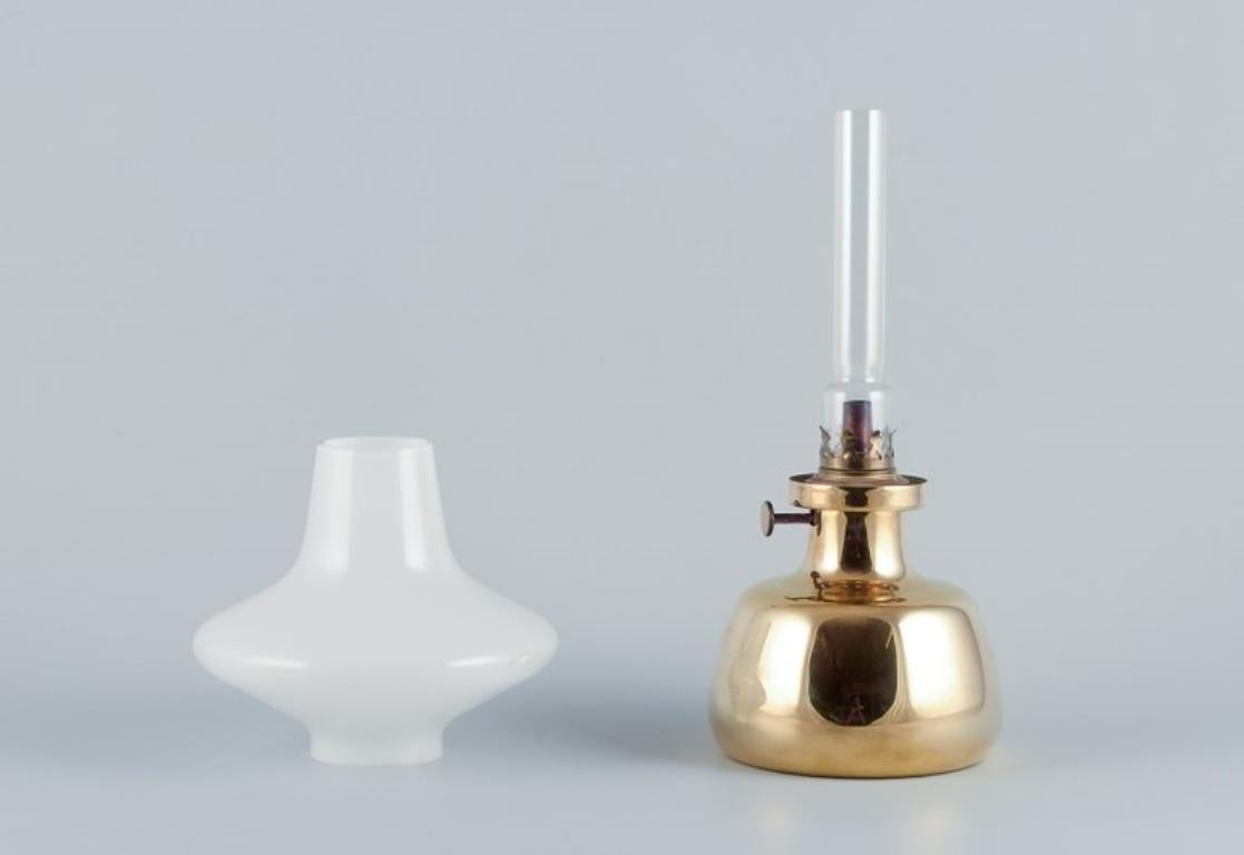 Henning Koppel for Louis Poulsen. Petronella oil lamp in brass. Opal glass shade In Excellent Condition For Sale In Copenhagen, DK