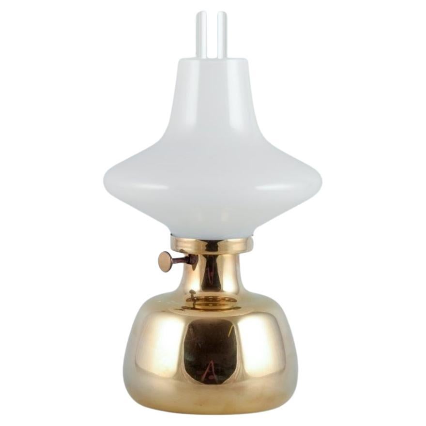 Henning Koppel for Louis Poulsen. Petronella oil lamp in brass. Opal glass shade For Sale
