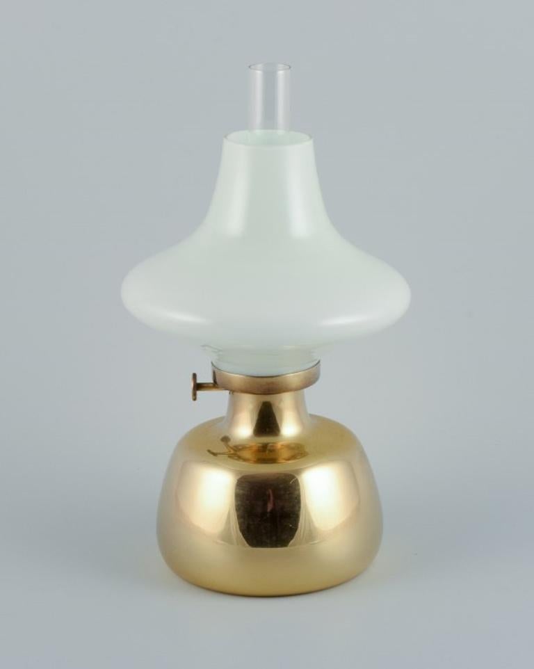 Henning Koppel for Louis Poulsen.
Petronella oil lamp in brass with opaline glass shade.
Designed in 1961.
In excellent condition.
Dimensions: H 34.0 x D 17.0 cm.