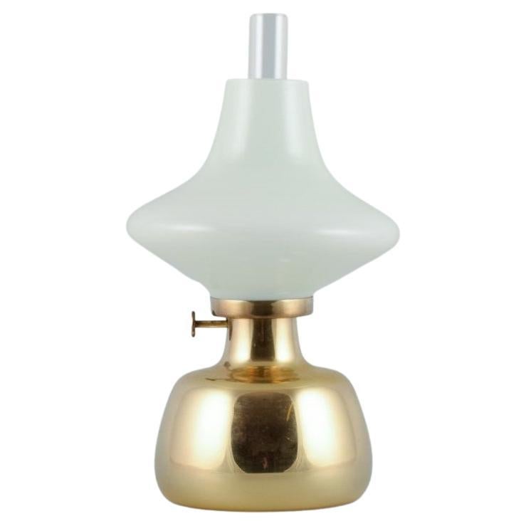 Henning Koppel for Louis Poulsen. Petronella oil lamp in brass with glass shade