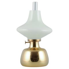 Henning Koppel for Louis Poulsen. Petronella oil lamp in brass with glass shade