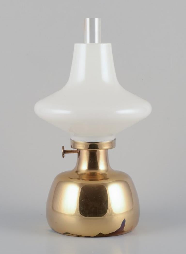 Danish Henning Koppel for Louis Poulsen.  Petronella oil lamp in brass with opal glass