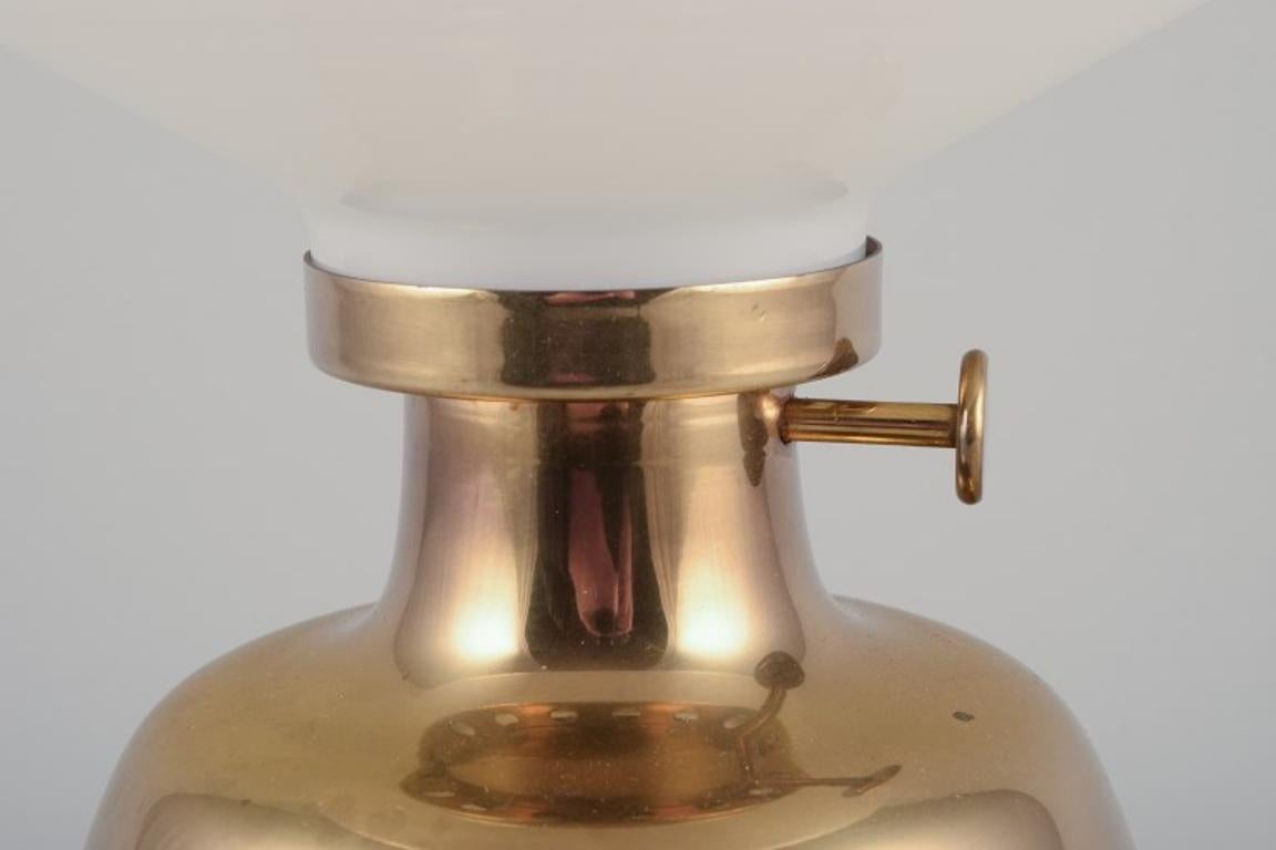 20th Century Henning Koppel for Louis Poulsen.  Petronella oil lamp in brass with opal glass