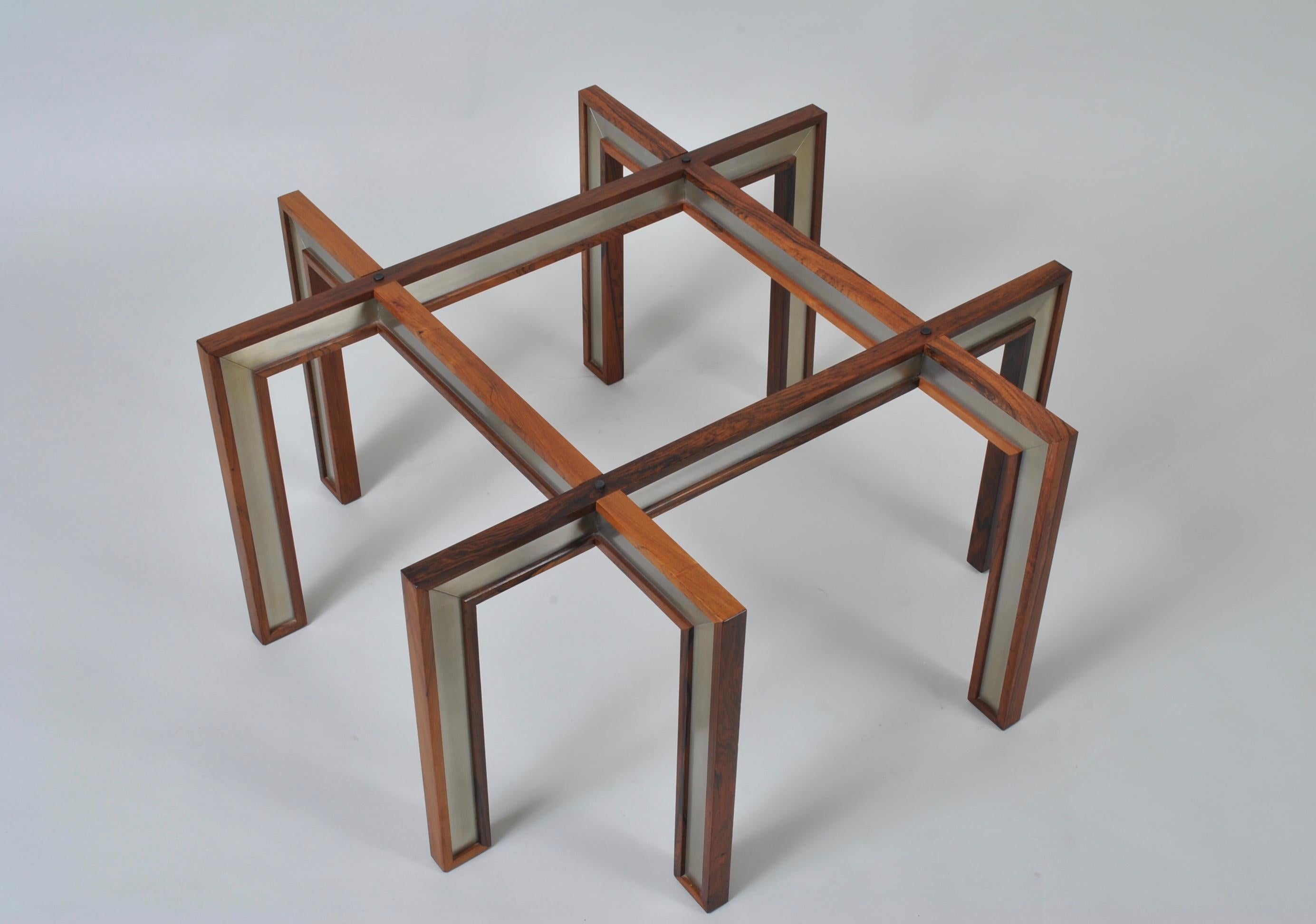 Distinctive glass, wood and brushed steel modernist design from Henning Korch. An excellent coffee or central table. Visually impressive. Thick glass surface. Produced by CFC Silkeborg, Denmark, circa 1960.