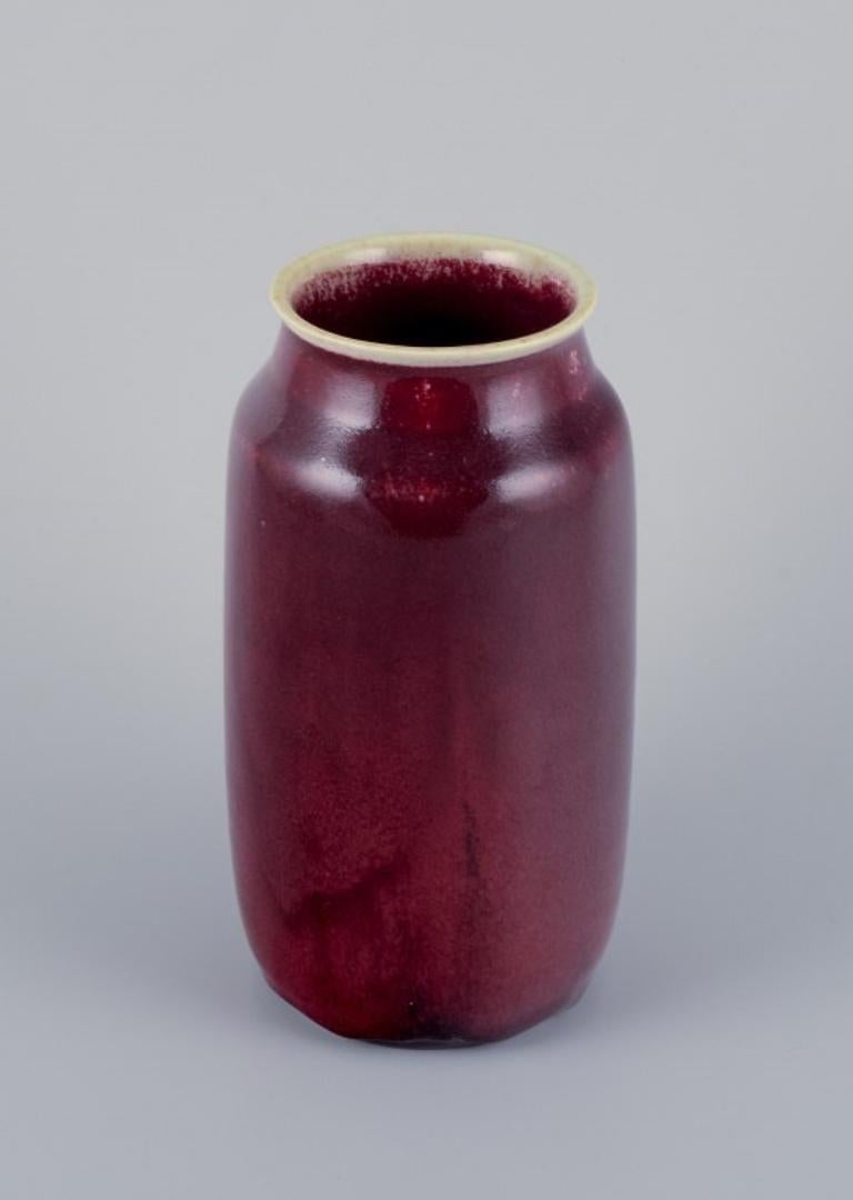 Henning Nilsson for Höganäs, Sweden.
Unique ceramic vase with a beautiful ox blood glaze. 
Signed and dated 5.3. 1965. 
In perfect condition. 
Dimensions: H 18.0 cm x D 8.5 cm.


