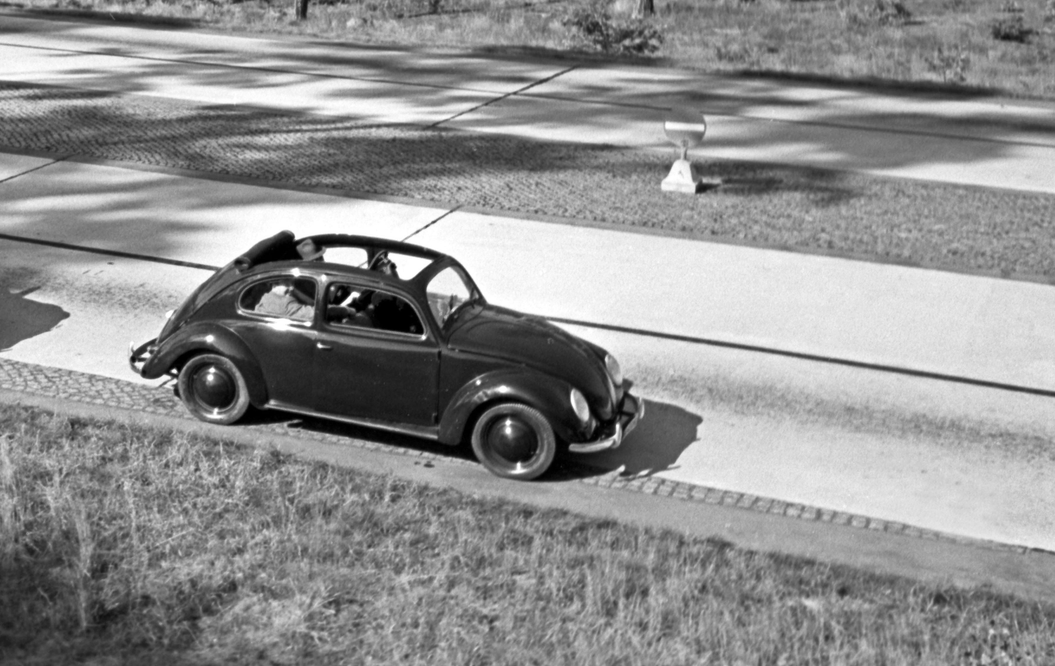 Three models of the Volkswagen beetle driving, Germany 1938 Printed Later  - Photograph by Henning Nolte