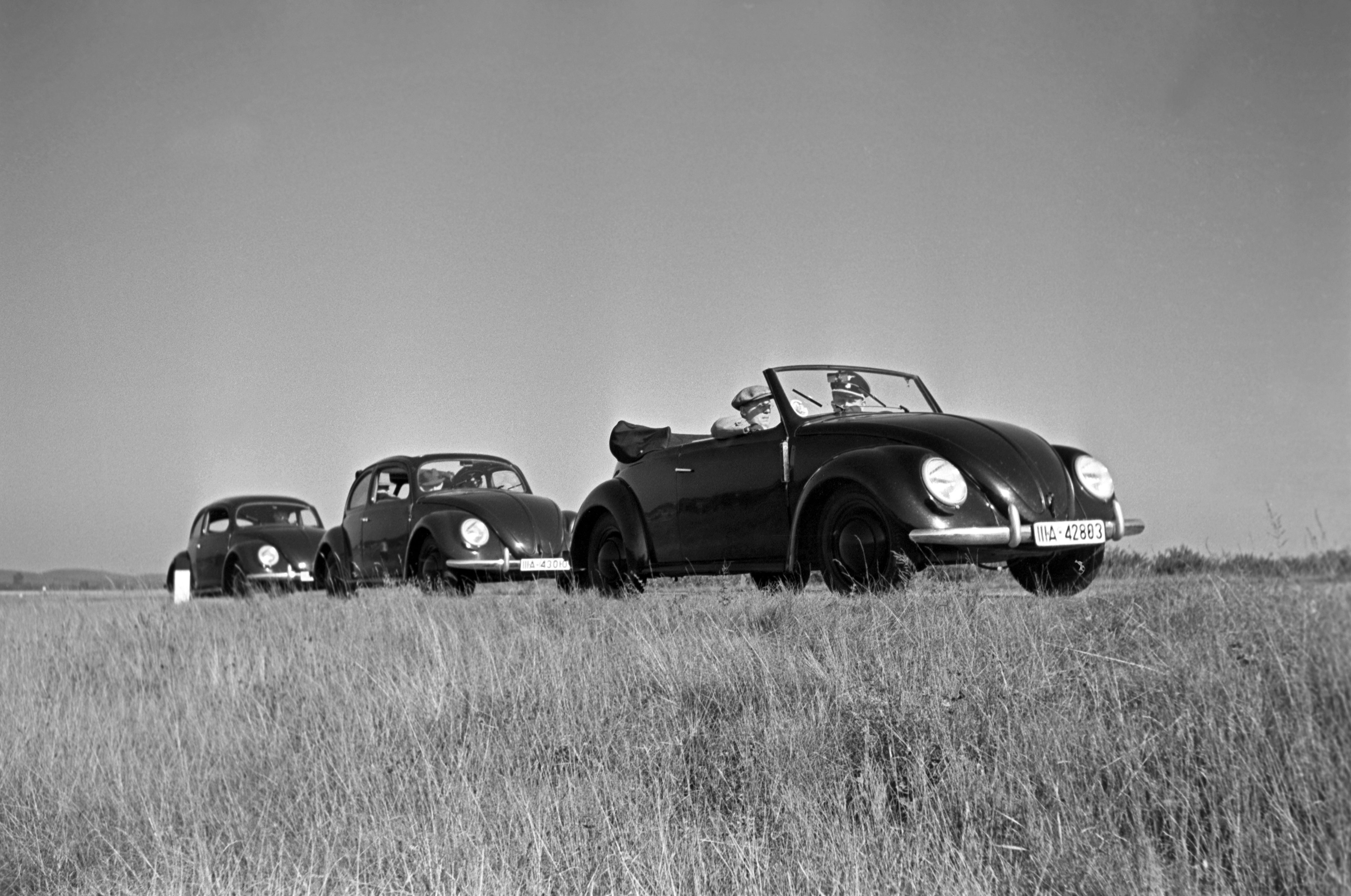 Henning Nolte Black and White Photograph - Three models of the Volkswagen beetle, Germany 1938 Printed Later 