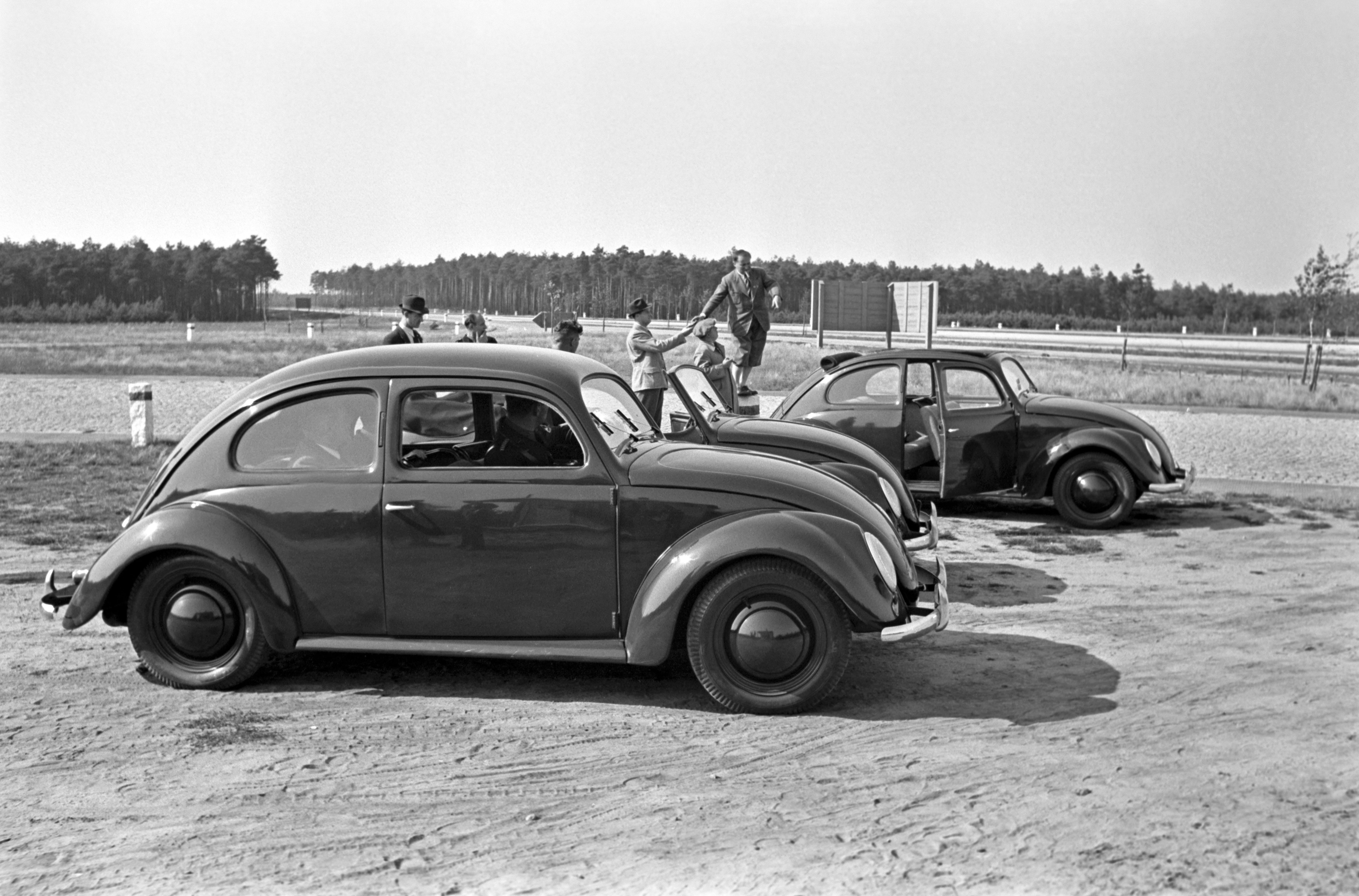 Henning Nolte Black and White Photograph - Three models of the Volkswagen beetle parking, Germany 1938 Printed Later 