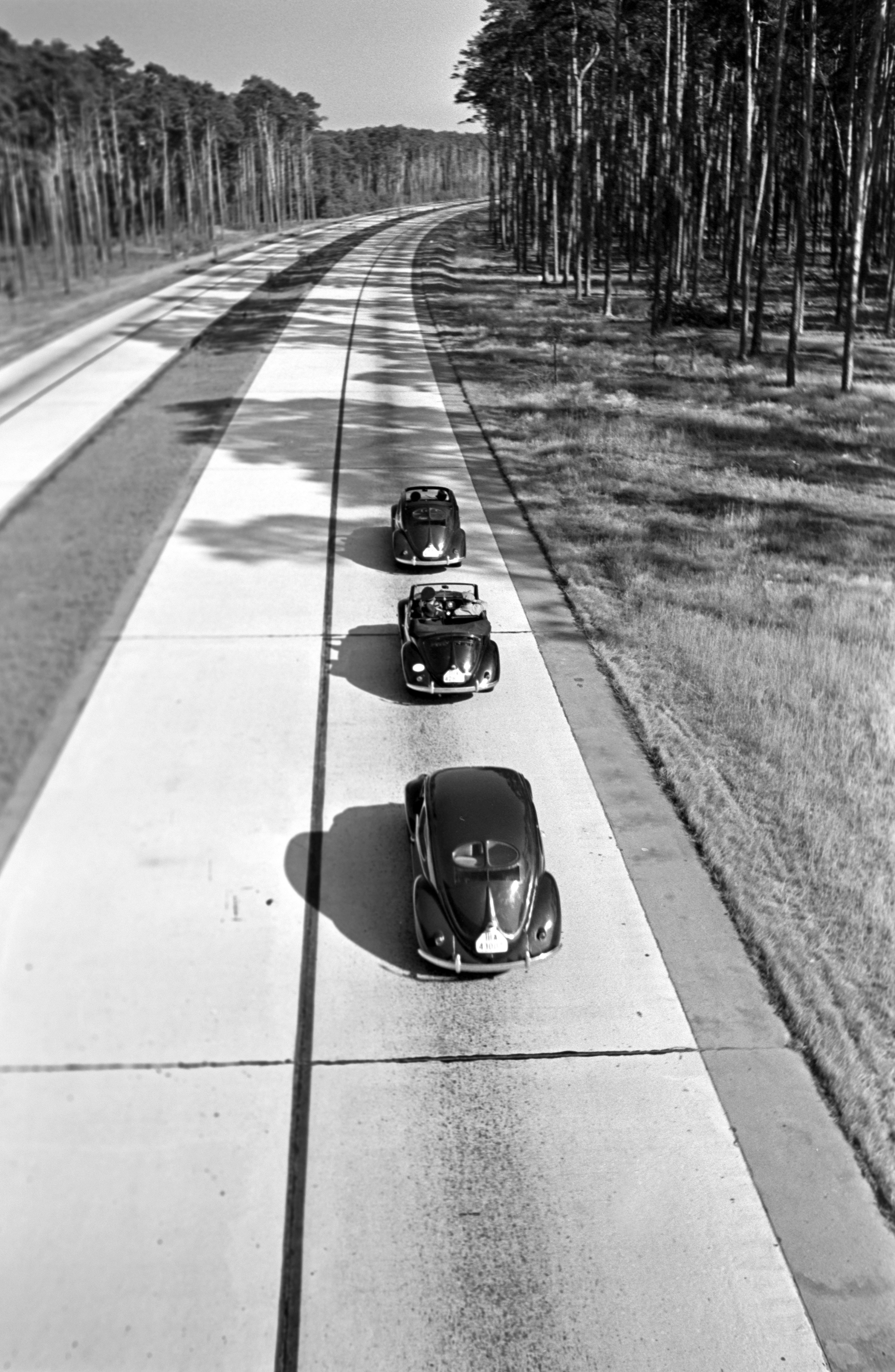 Henning Nolte Black and White Photograph - Three Volkswagen beetle on street, Germany 1938 Printed Later 