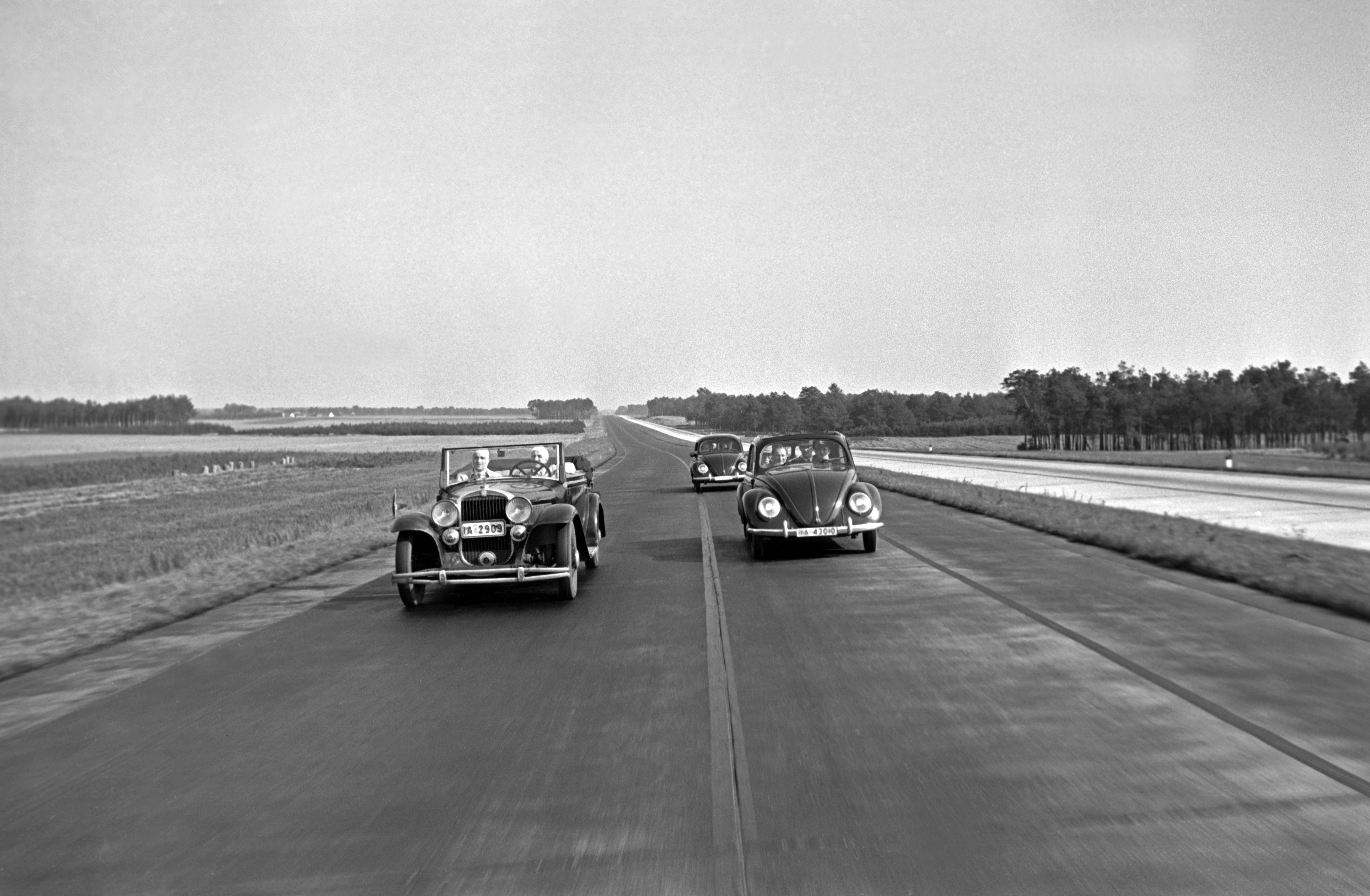 Henning Nolte Black and White Photograph - Two different models of the Volkswagen beetle, Germany 1938 Printed Later 