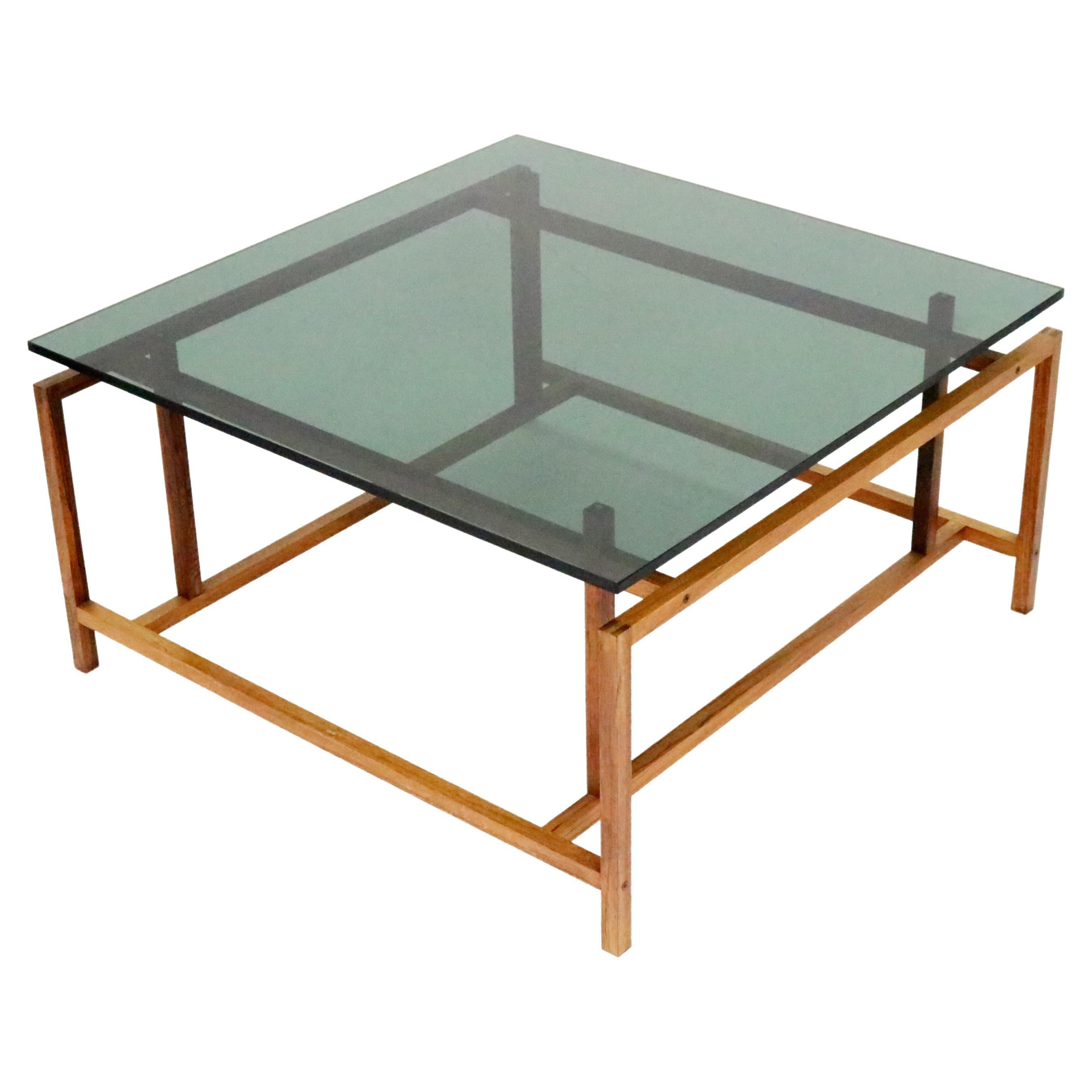 Henning Norgaard pour Komfort table basse en bois de rose et plateau en verre flottant