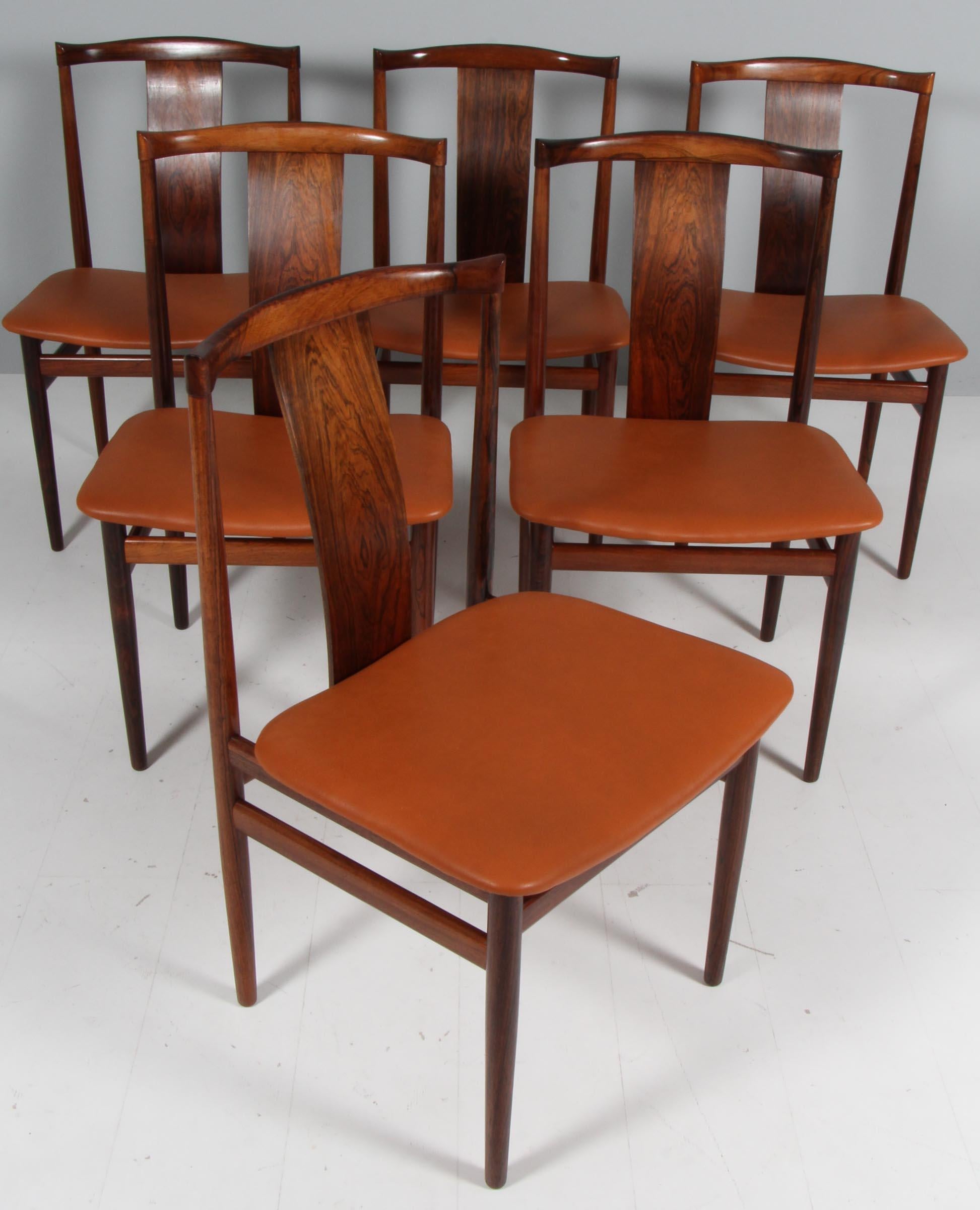 Henning Sørensen set of six high back dining chairs in partly solid rosewood.

New upholstered with tan full grain aniline leather.

Made by Dan-EX in the 1960s.