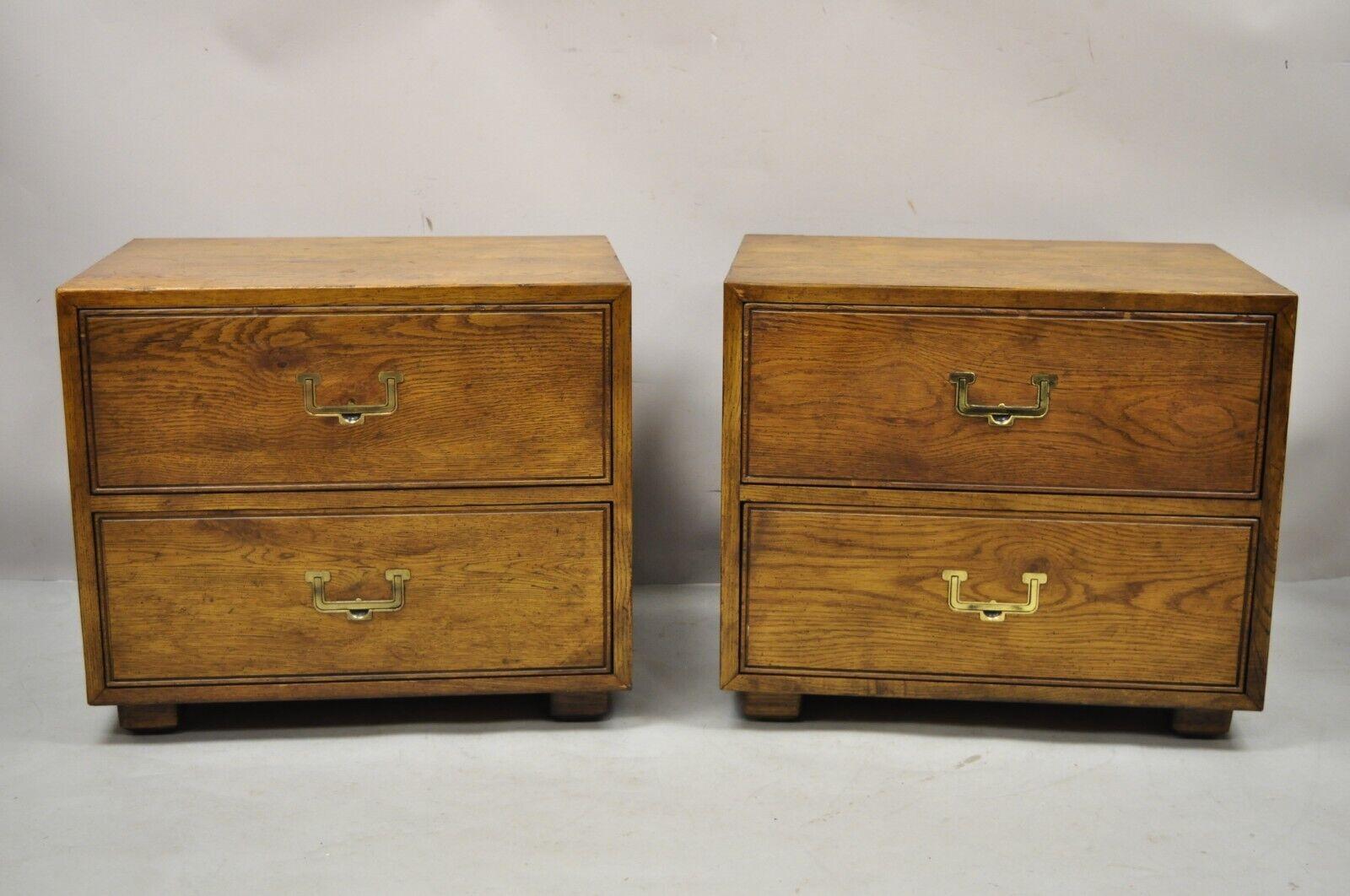 Henredon Artefacts Campaign Style Hollywood Regency 2 drawer nightstands - a pair. Item features artefacts collection, beautiful wood grain, original label, 2 dovetailed drawers, solid brass hardware, quality American craftsmanship. Circa mid 20th