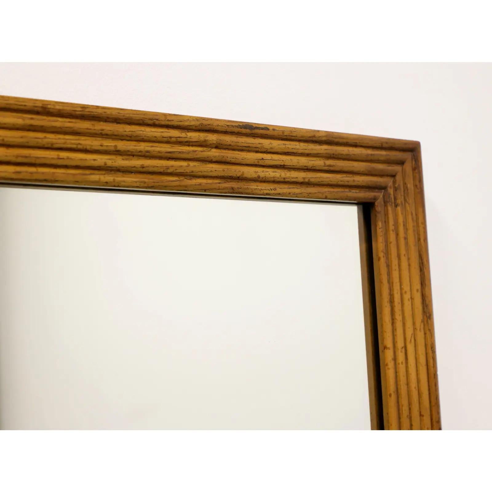 Wonderful and fine pair of Henredon wall mirror in ribbed oak. These have factory mounted wall brackets & steel-wires for easy instillation. Condition is great. No issues.