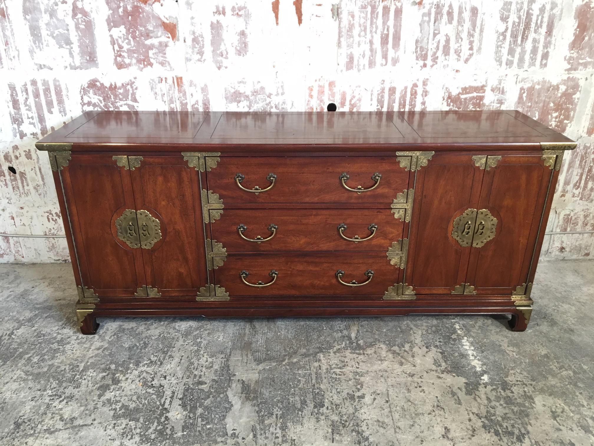 Midcentury server or buffet by Henredon in Asian chinoiserie style features generous brass detailing and solid wood construction. Good vintage condition with age appropriate signs of wear.