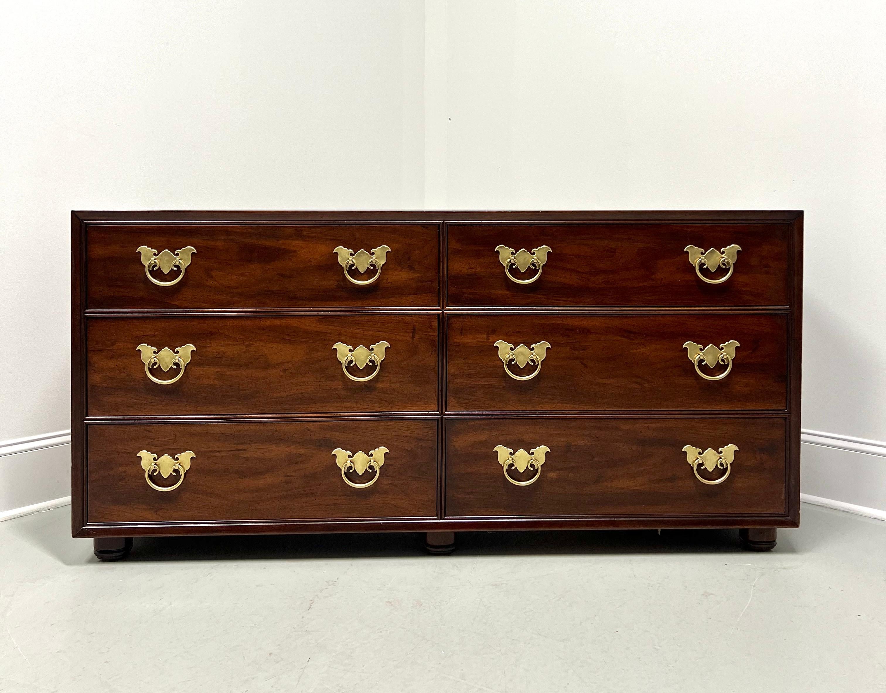 An Asian Chinoiserie style double dresser by Henredon. Walnut with decorative brass hardware, smooth squared edge to the top, and bun feet. Features six large drawers of dovetail construction, three having removable dividers. Made in Morganton,