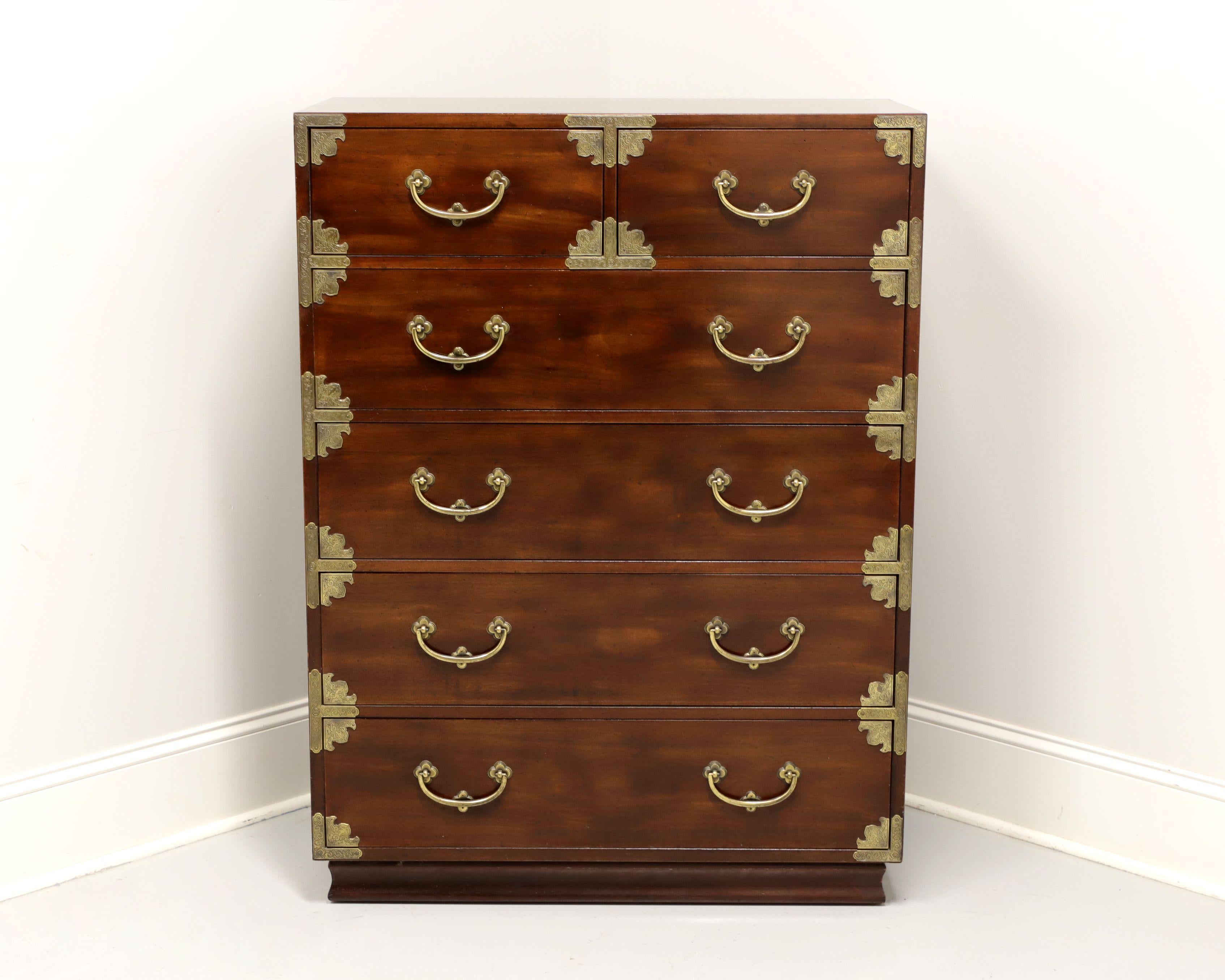 A chest of drawers in the Japanese Tansu Campaign style by Henredon. Mahogany with a rich brown finish with brass accents and hardware. Features two smaller over four larger dovetail drawers, top larger drawer having removable dividers. Made in