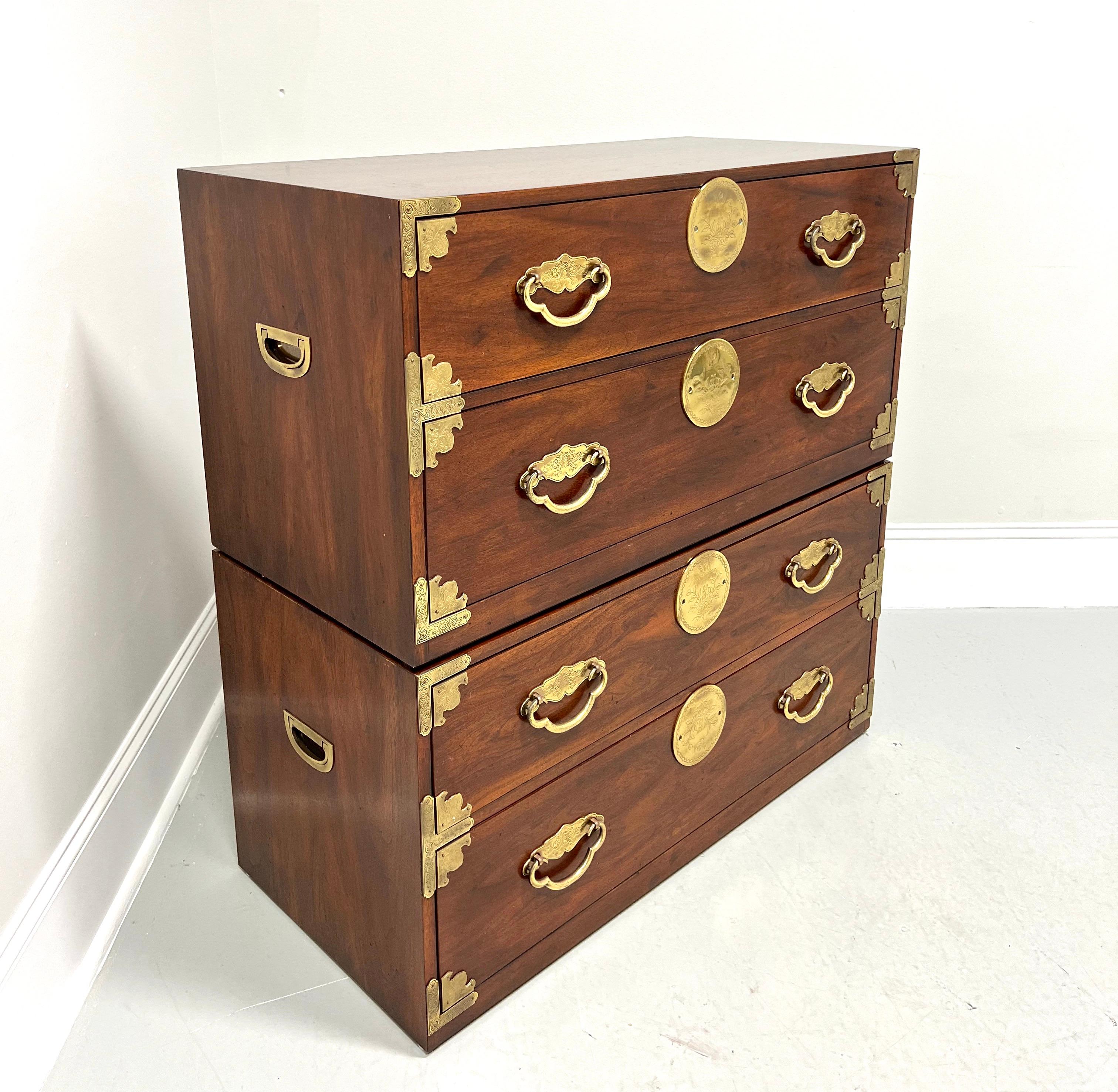 A pair of modular stackable two-drawer chests in the Japanese Tansu Campaign style by Henredon. Mahogany with smooth surface top, low height, brass accents, drawer handles & side handles, and stackable. Features two large drawers of dovetail