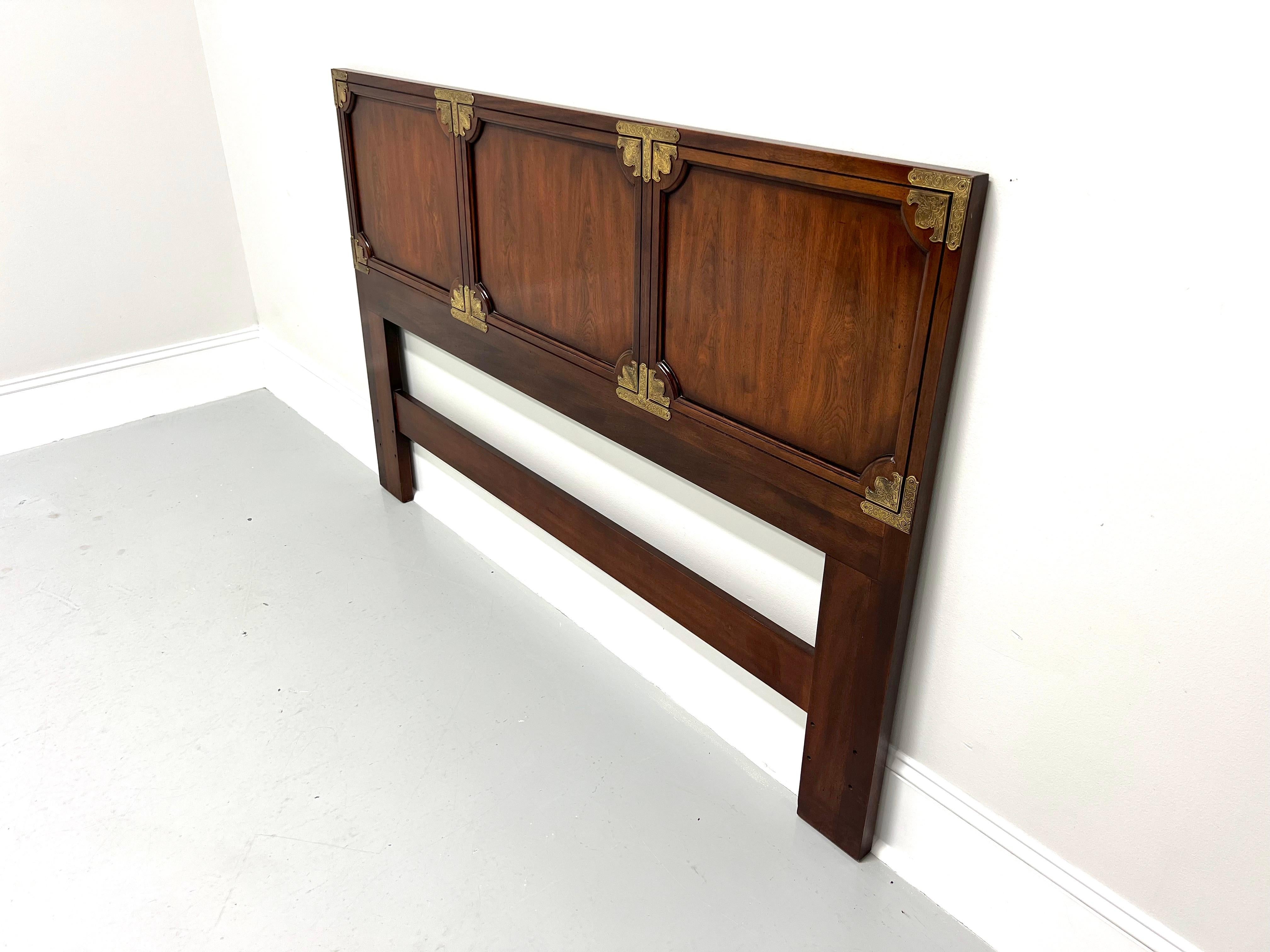 A queen size headboard in the Japanese Tansu Campaign style by Henredon. Solid mahogany forming three panels with decorative brass accents at the corners of each panel. Made in Morganton, North Carolina, USA, in the late 20th Century.

Style #: 