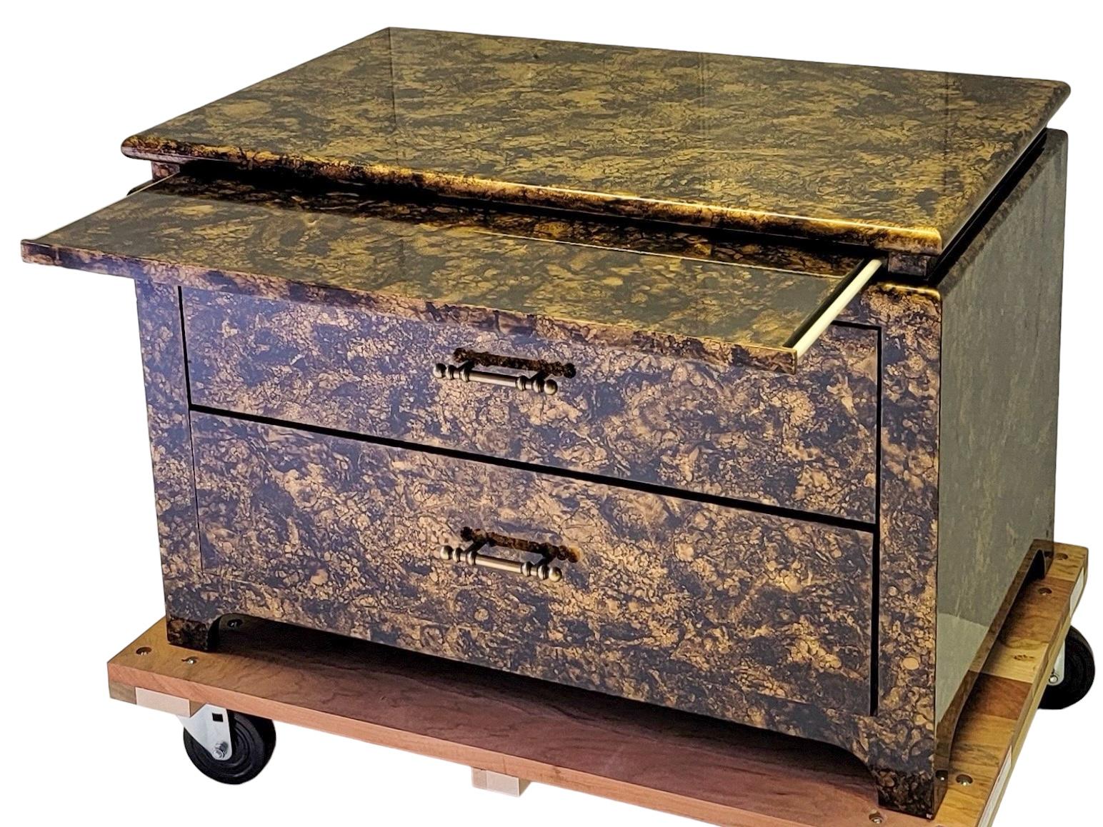 I love this piece. It is by Henredon. It is an Asian modern style chest with a high gloss faux tortoise finish. It is a low profile piece, so it would look great at the foot of a bed or as a coffee table too…very chic. It does feature a draw out