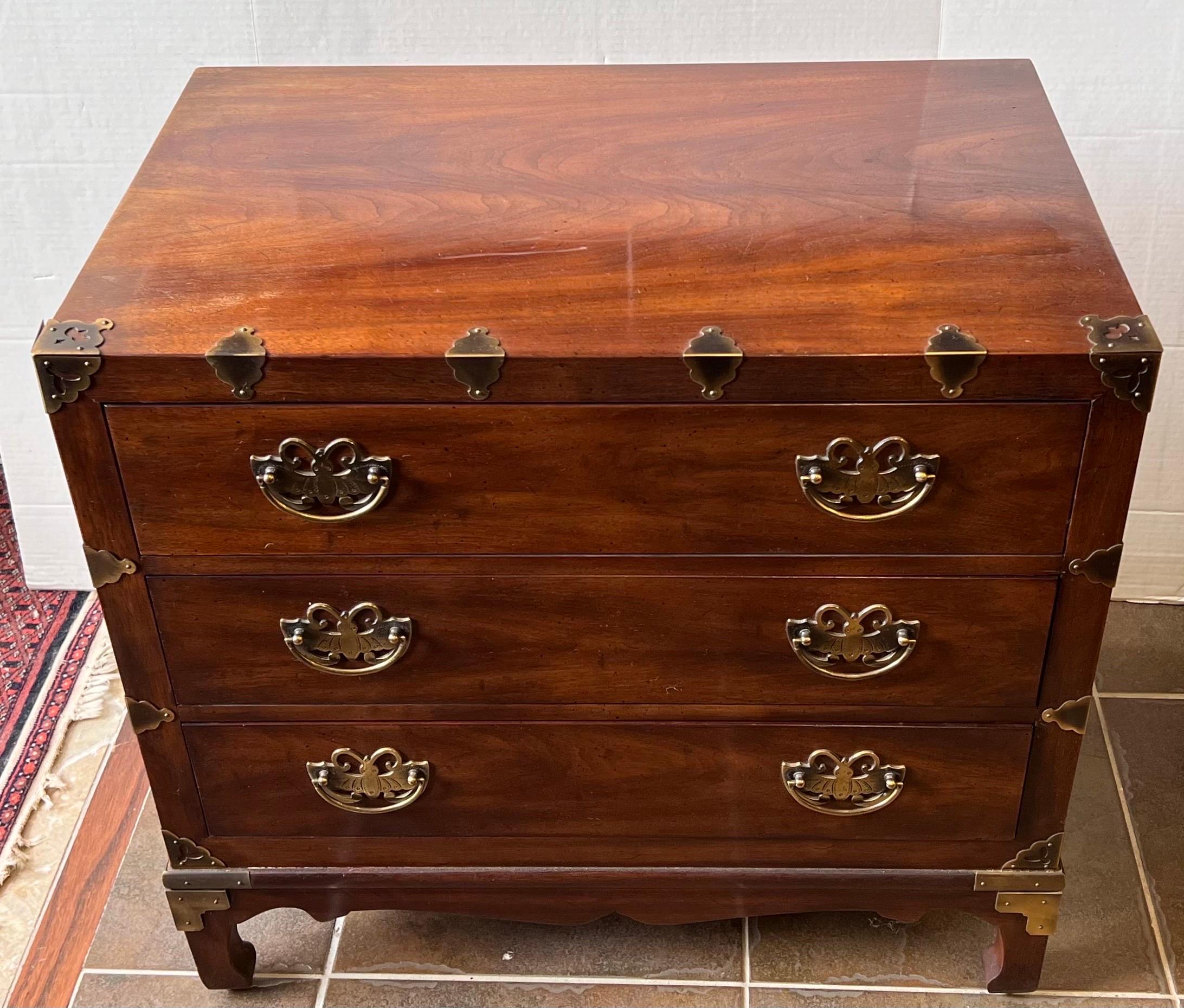 Stunning small chinoiserie styled three drawer chest of drawers with original brass butterfly shaped pulls and brass detail.  All Henredon hallmarks are present.