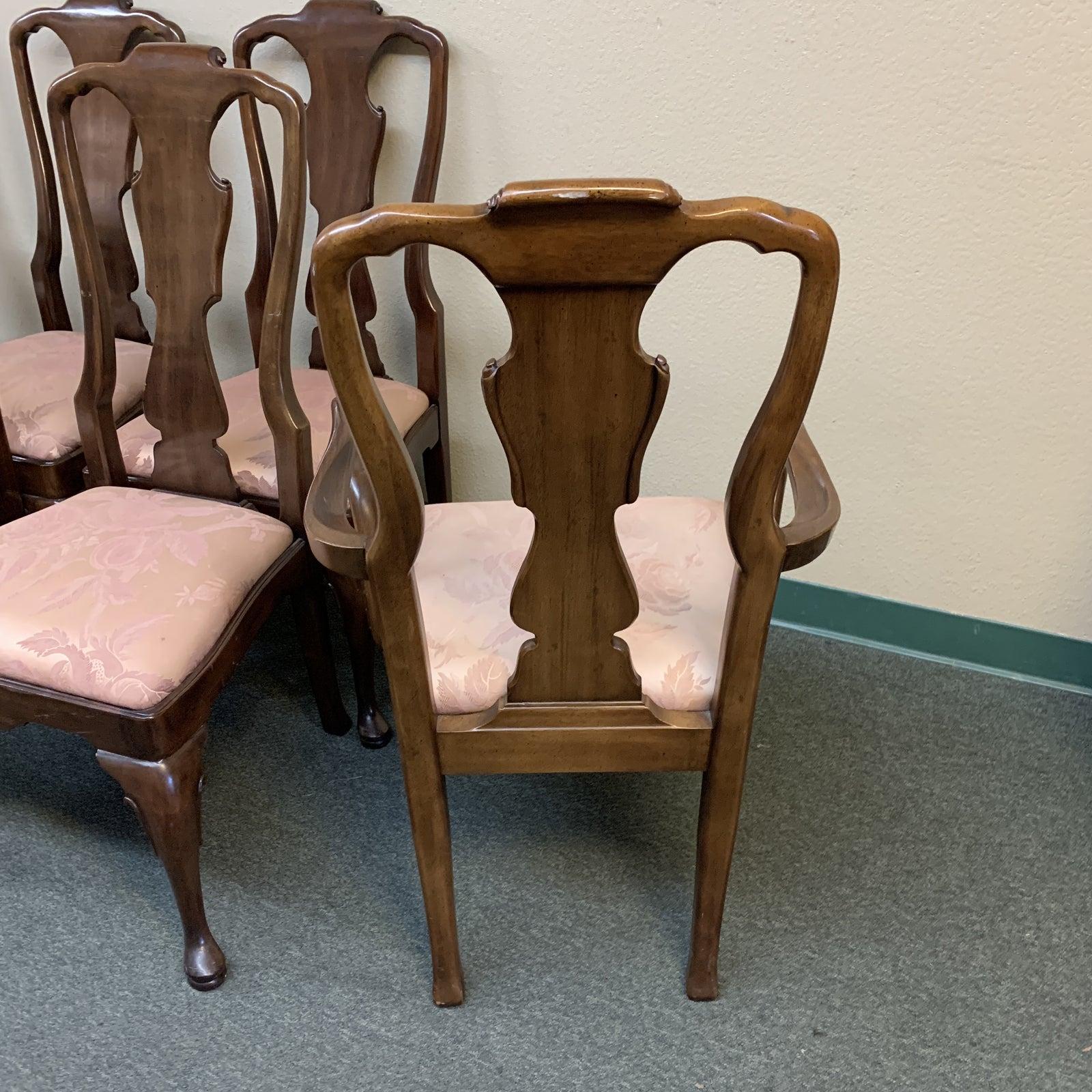 Presents a set of six Henredon Aston Court collection chairs. Ball and claw frame is slenderly finished in rich walnut tone. Seat upholstered with dusty rose damask patterning. Minor wear on frame and staining on seats. Makers mark on the bottom of