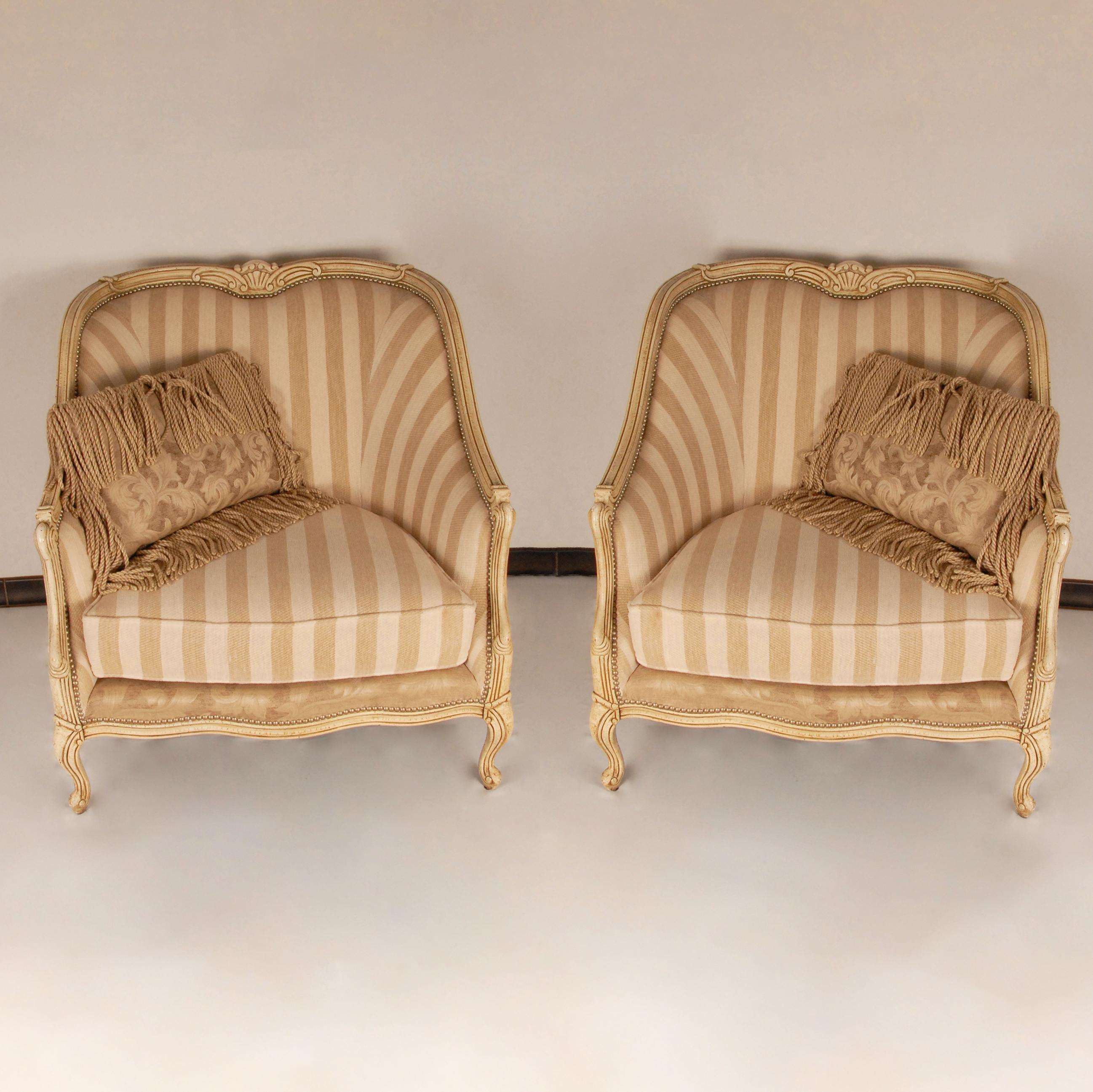Henredon Beacon Hill oversized upholstered Bergère arm chairs.
A pair French country painted Bergère armchairs.
Materials: Fruitwood, Fabric
Design: By Henredon
Style: French Country, French Provincial, Baroque, Rococo, Antique 
Origin: United