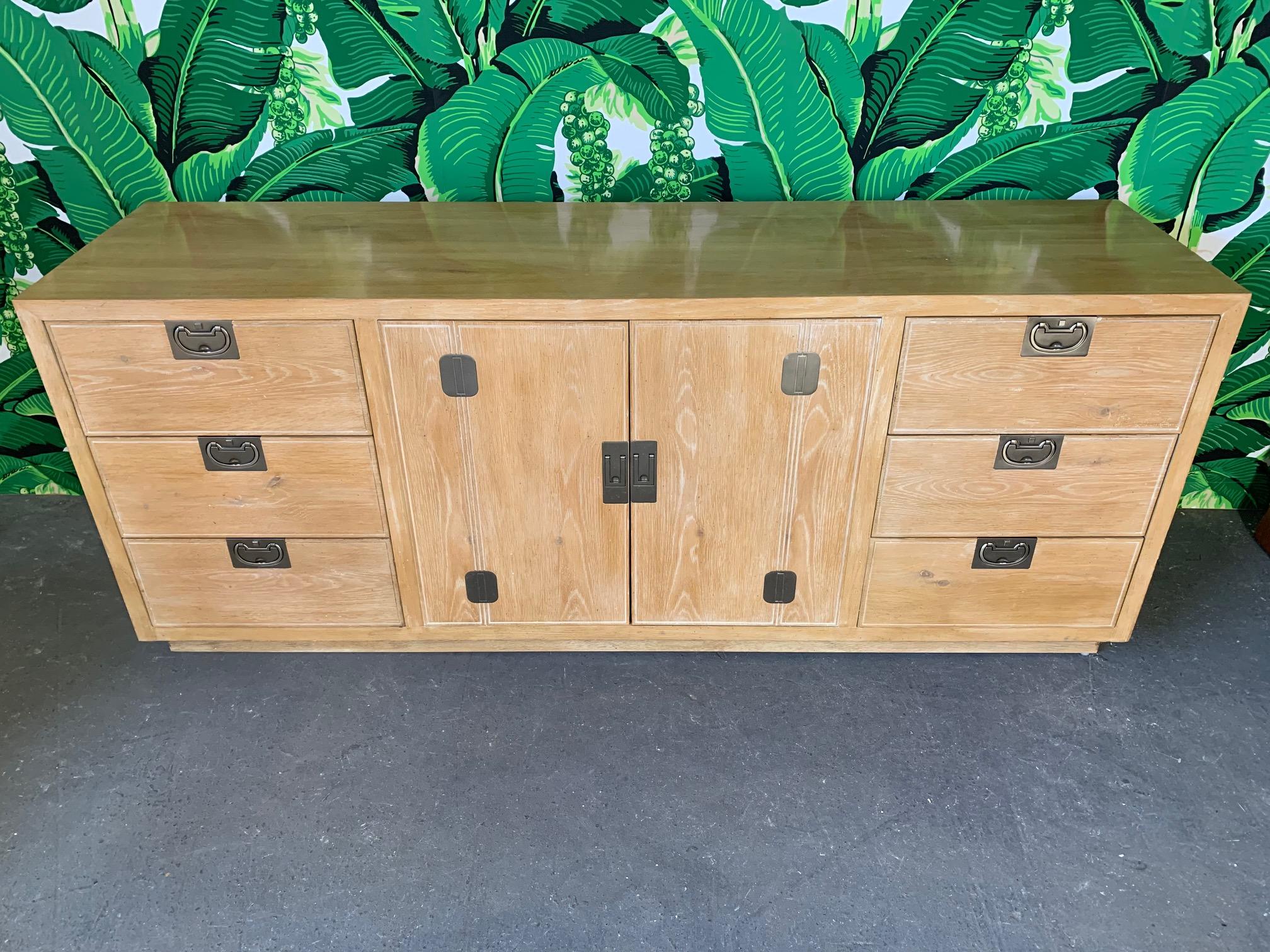 Vintage credenza by Henredon from their Bel Air collection. Perfect as sideboard or server, or even as dresser. Heavy hardware and plinth base. Very good condition with minor imperfections consistent with age.