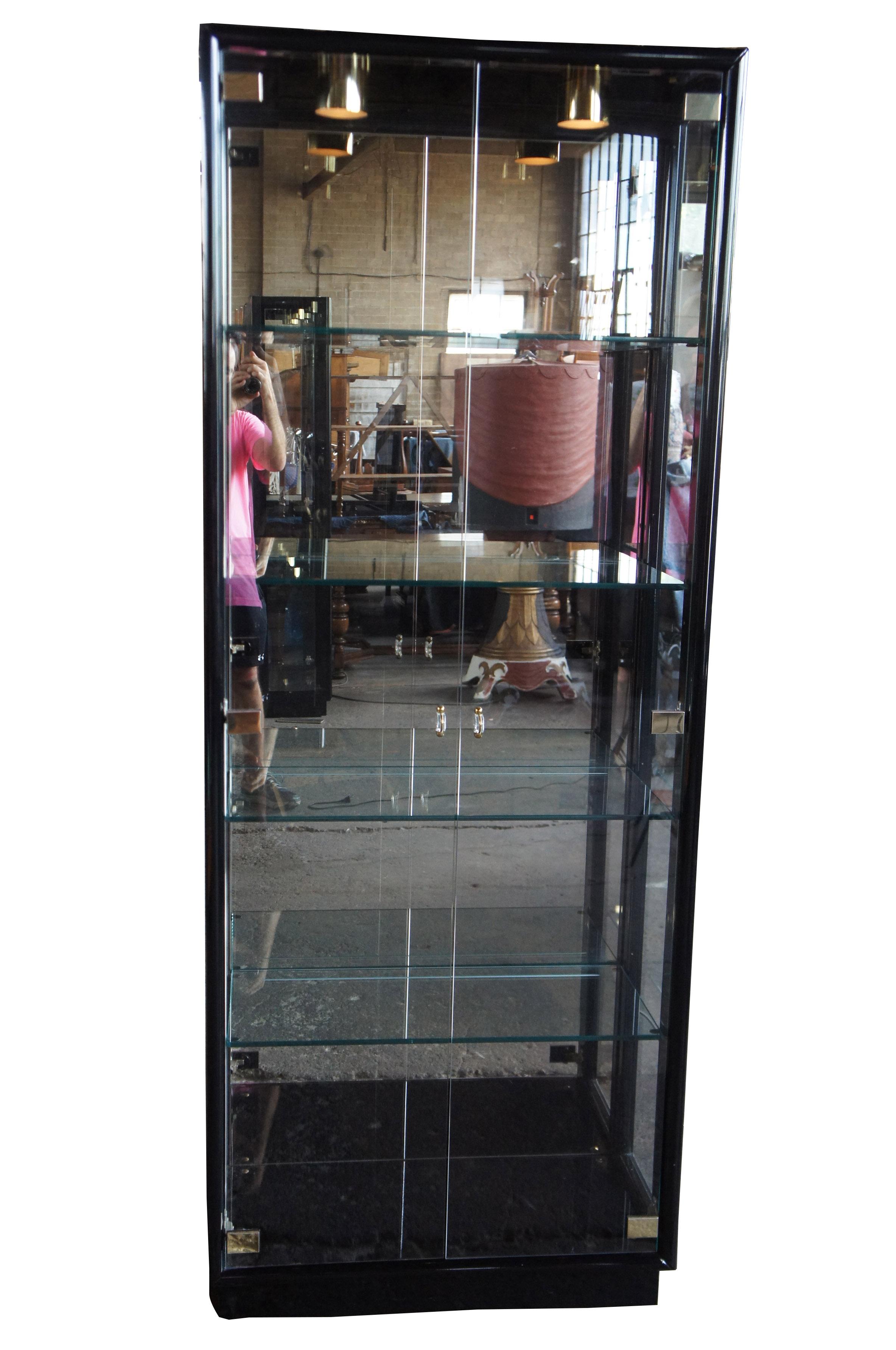 Henredon black lacquer Asian modern curio display cabinet bunching scene three

Up for consideration is a beautiful Henredon curio cabinet. Manufactured in 1988. These cabinets can be used as a stand alone or bunched together. Features a sleek