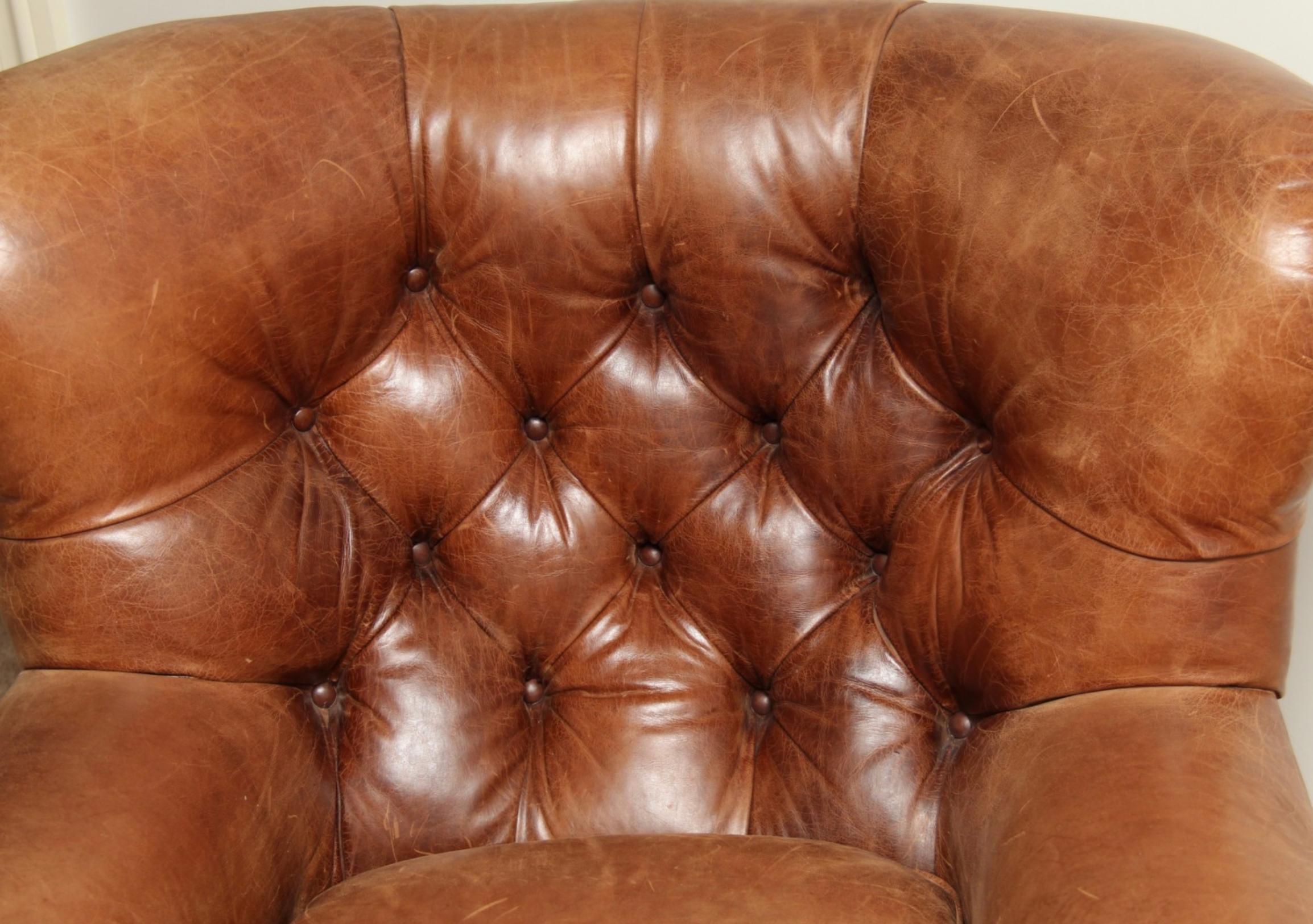 brown leather chair and ottoman