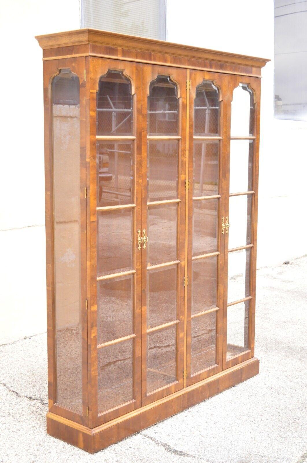 Henredon Burl wood double China cabinet display cabinet lighted Curio. Item features beautiful burl wood, beveled glass panels, 4 swing doors, original label, 8 adjustable glass shelves, quality American craftsmanship. Circa mid to late 20th