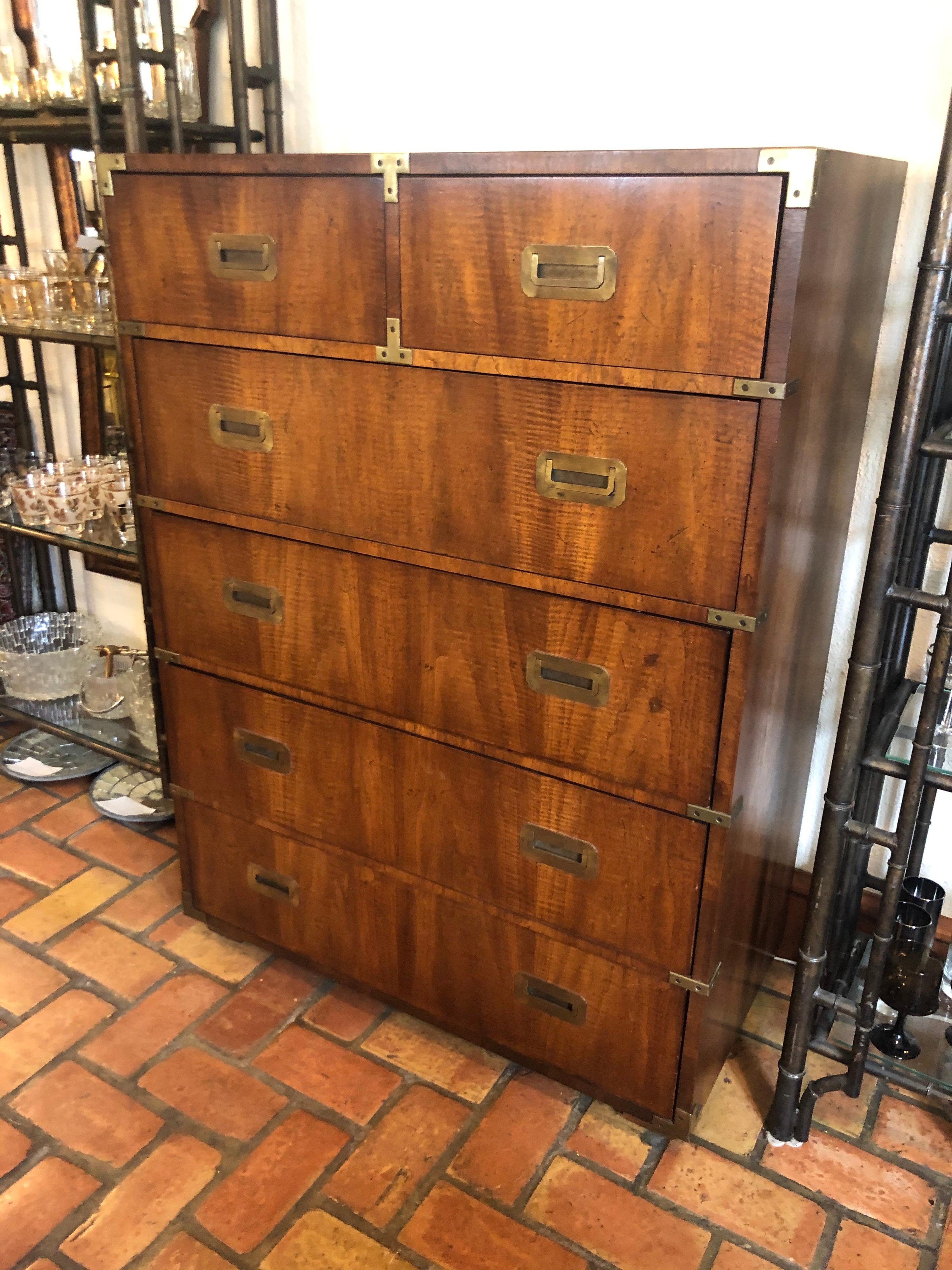 Henredon Style Campaign high boy dresser in walnut. Lots of storage in this walnut beauty.
Brass accents adorn this classic, timeless piece. In excellent vintage condition.