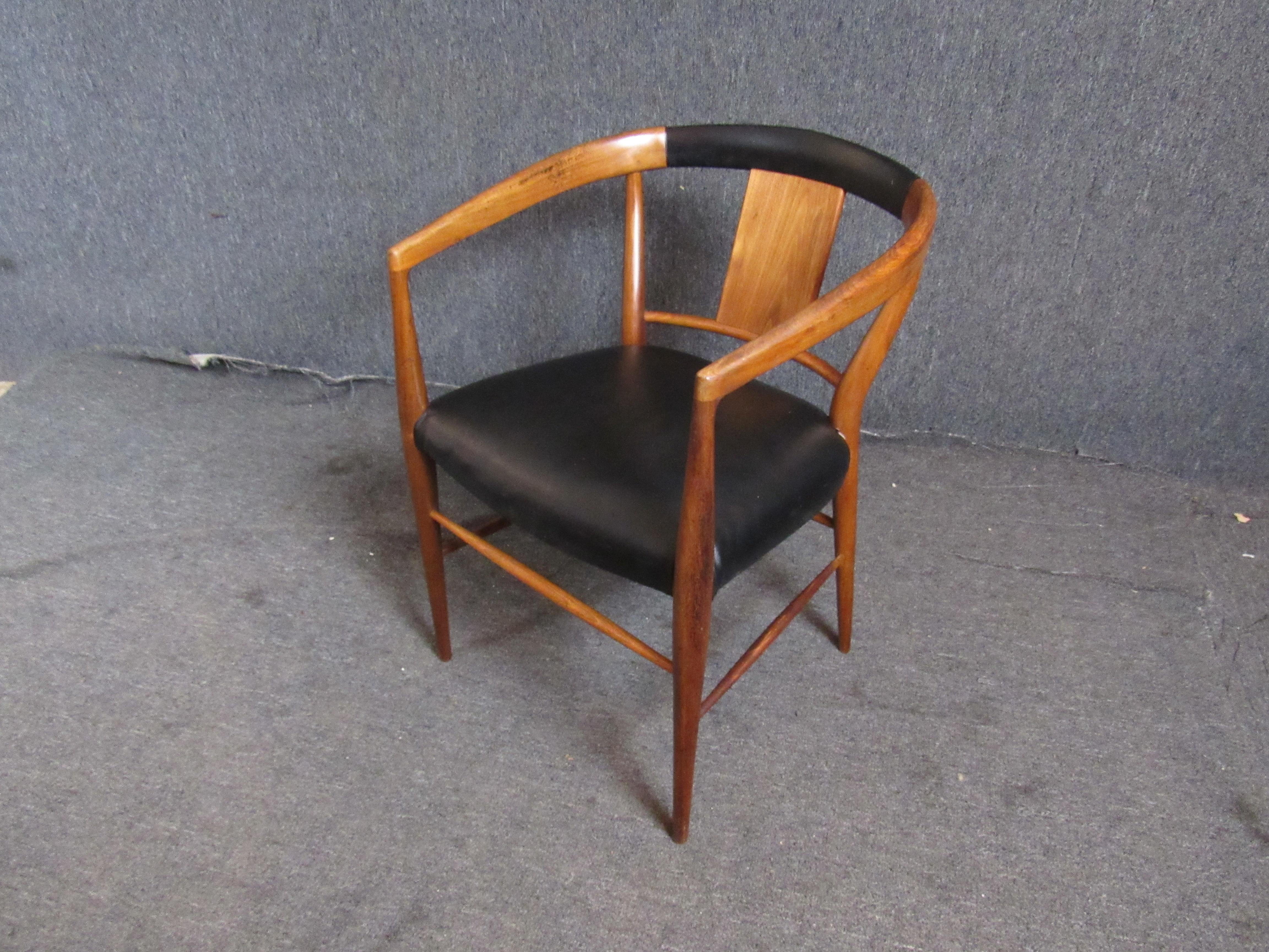 Round back armchair by Henredon for their Cantonesian collection. Great mid-century modern form with sculpted wood frame and black seating.
Please confirm location NY or NJ.