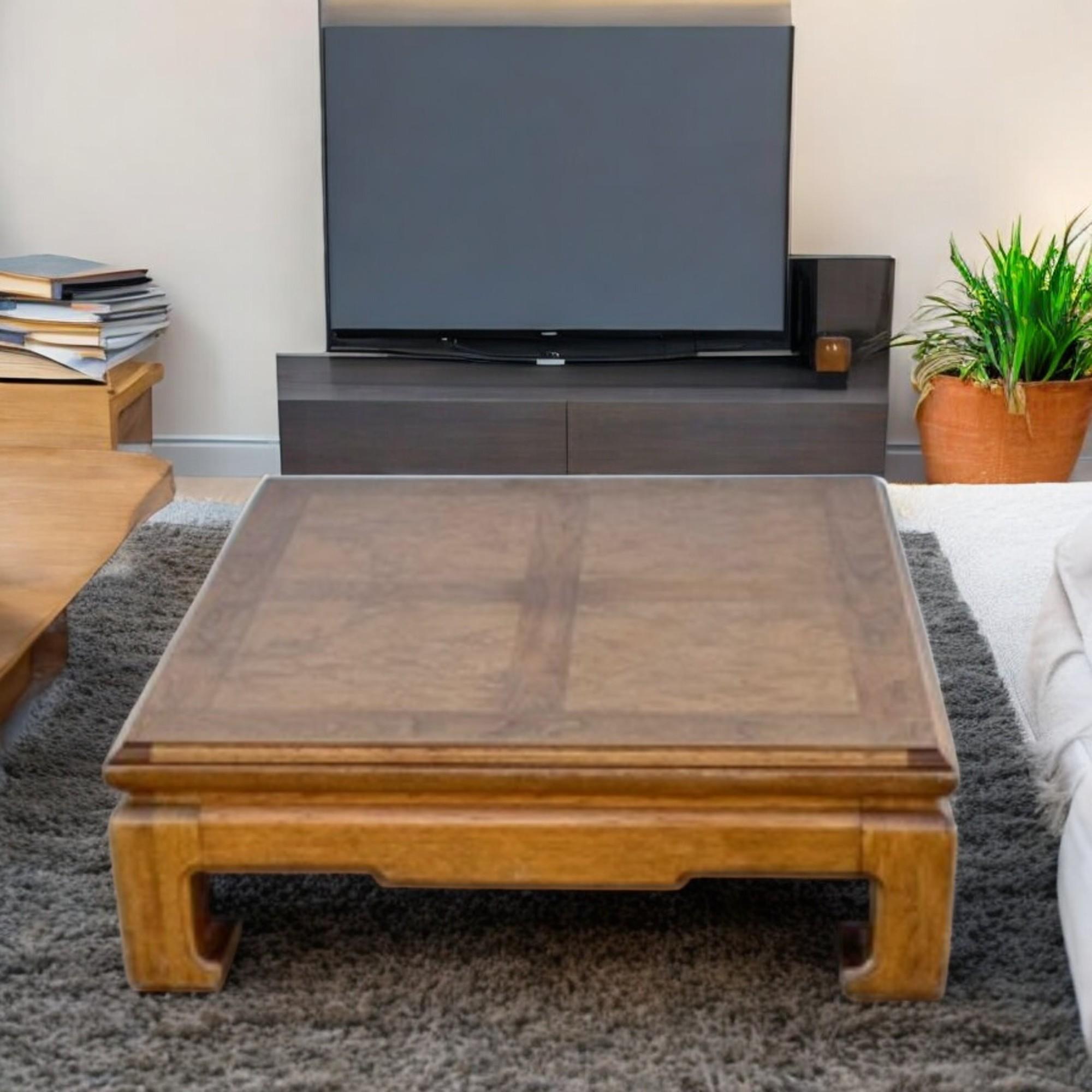 This stunning coffee table embodies the timeless elegance of Henredon’s Chin Hua style, blending classic design with refined craftsmanship. Crafted from rich wood with a warm, lustrous finish, the tabletop showcases a striking veneer inlay pattern,